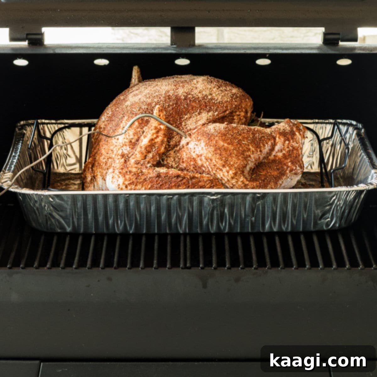 A cropped square image showing a pellet grill smoked turkey.