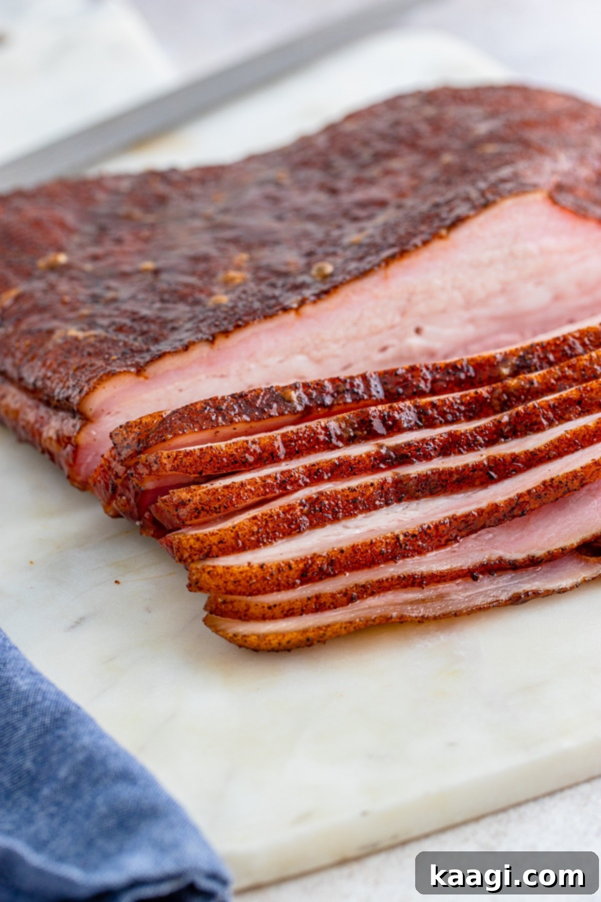 Smoked Pork Belly sliced, showing crispy skin and tender meat.