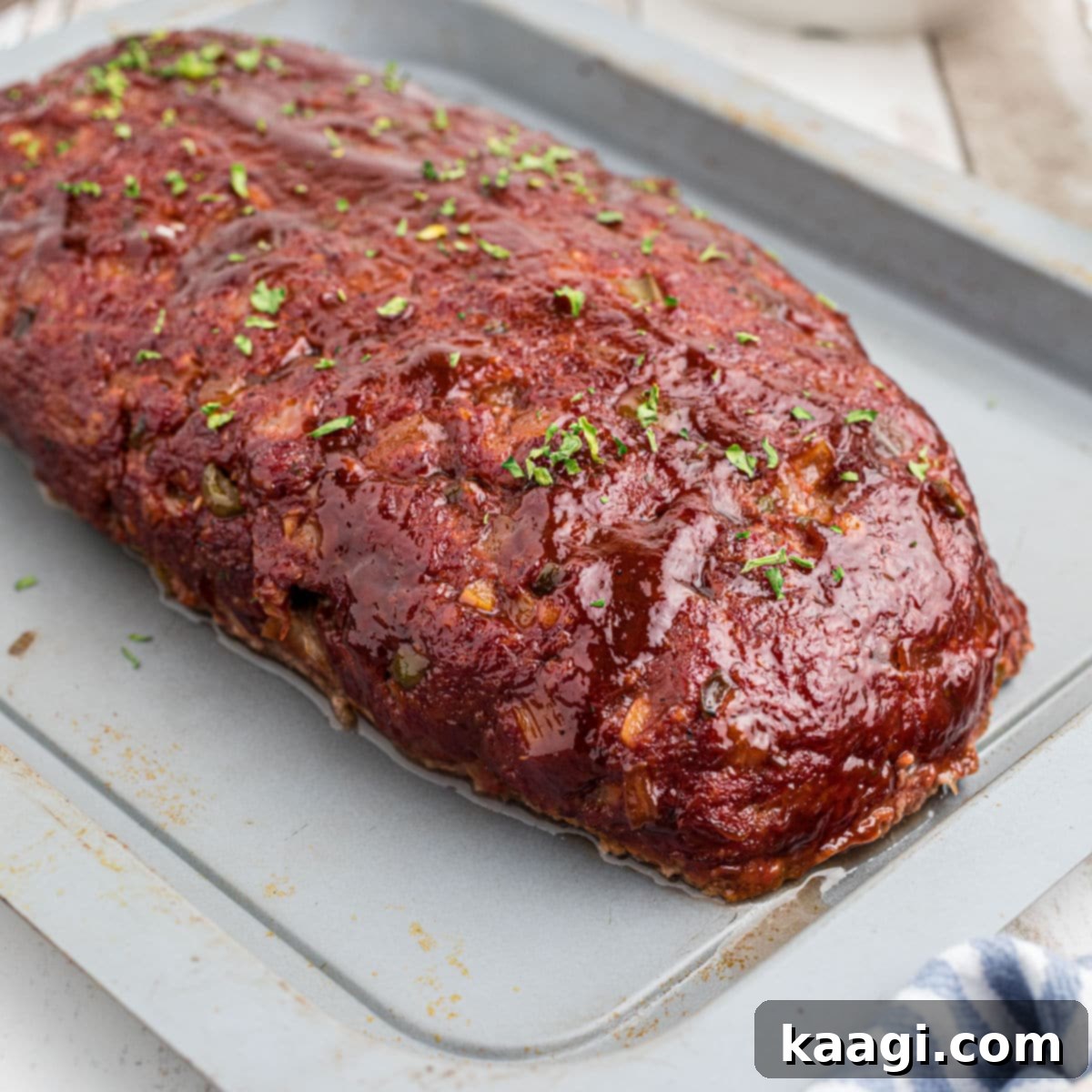A smoked meatloaf on a pan.
