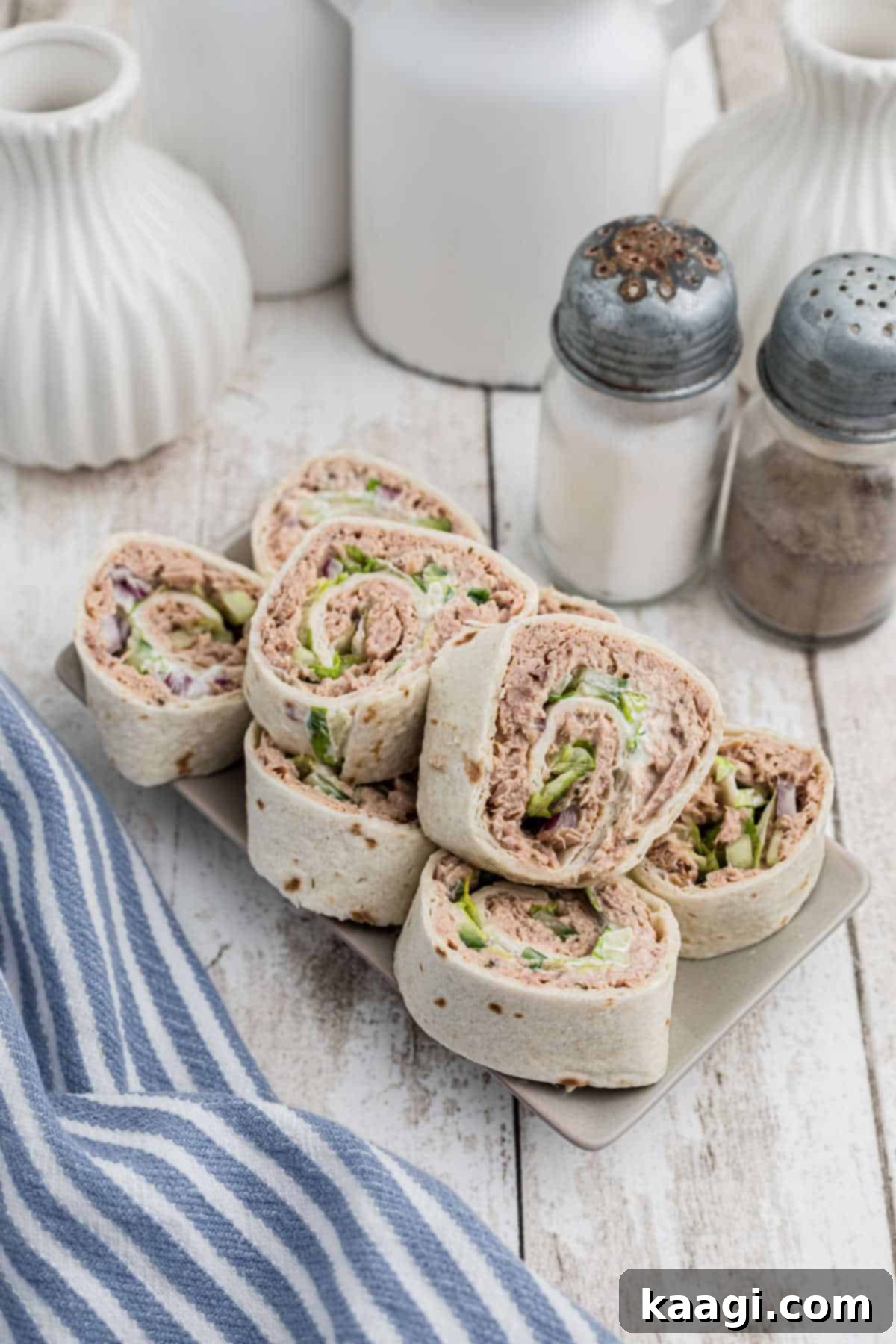 A small plate showcasing beautifully arranged tuna pinwheels, ready to be served.