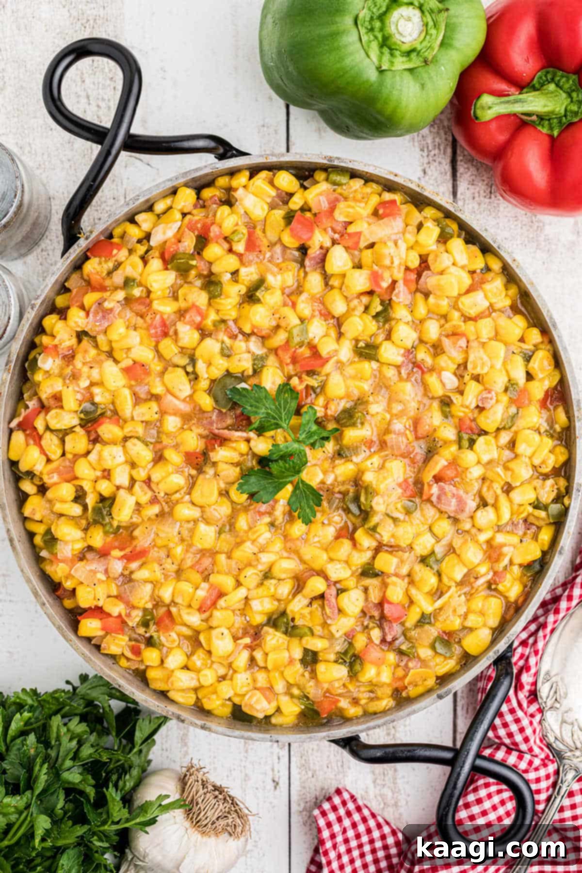 Overhead shot of a skillet with cajun corn maque choux.