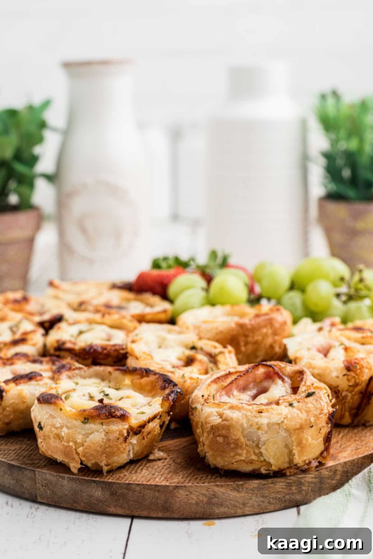 Ham and cheese bites on a board, close up.