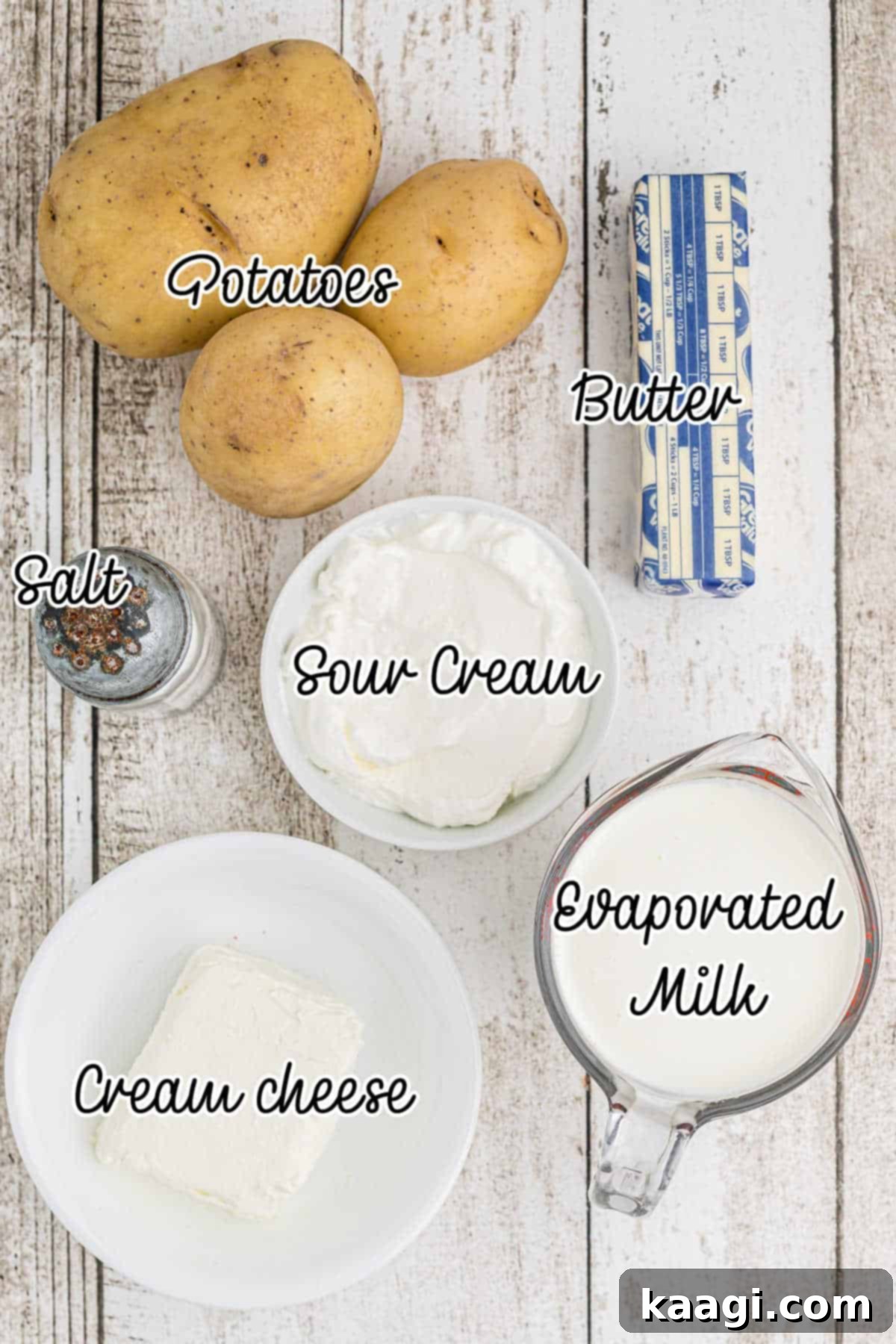 Amish Farmhouse Mashed Potatoes 3 Ingredients laid out for what is needed to make amish mashed potatoes, showcasing fresh potatoes, dairy, and butter.