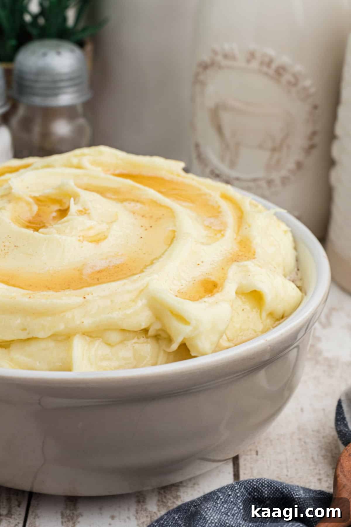 Amish Farmhouse Mashed Potatoes 5 Side shot close up of a bowl of amish mashed potatoes, showing the steam and richness.
