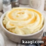 Amish Farmhouse Mashed Potatoes 6 Side shot of a bowl of amish mashed potatoes cropped square, ready to pin.