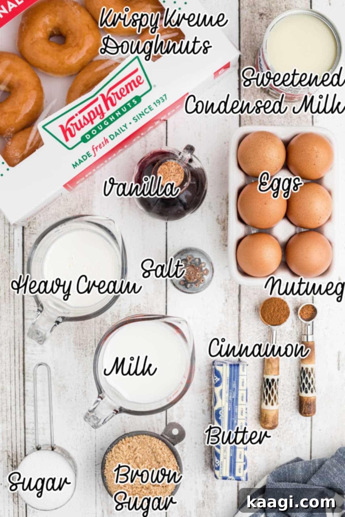 A neatly arranged collection of ingredients necessary to prepare a luscious Krispy Kreme bread pudding recipe, including doughnuts, eggs, milk, and spices.