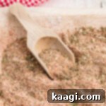 Close up of a wooden bowl full of all purpose seasoning.