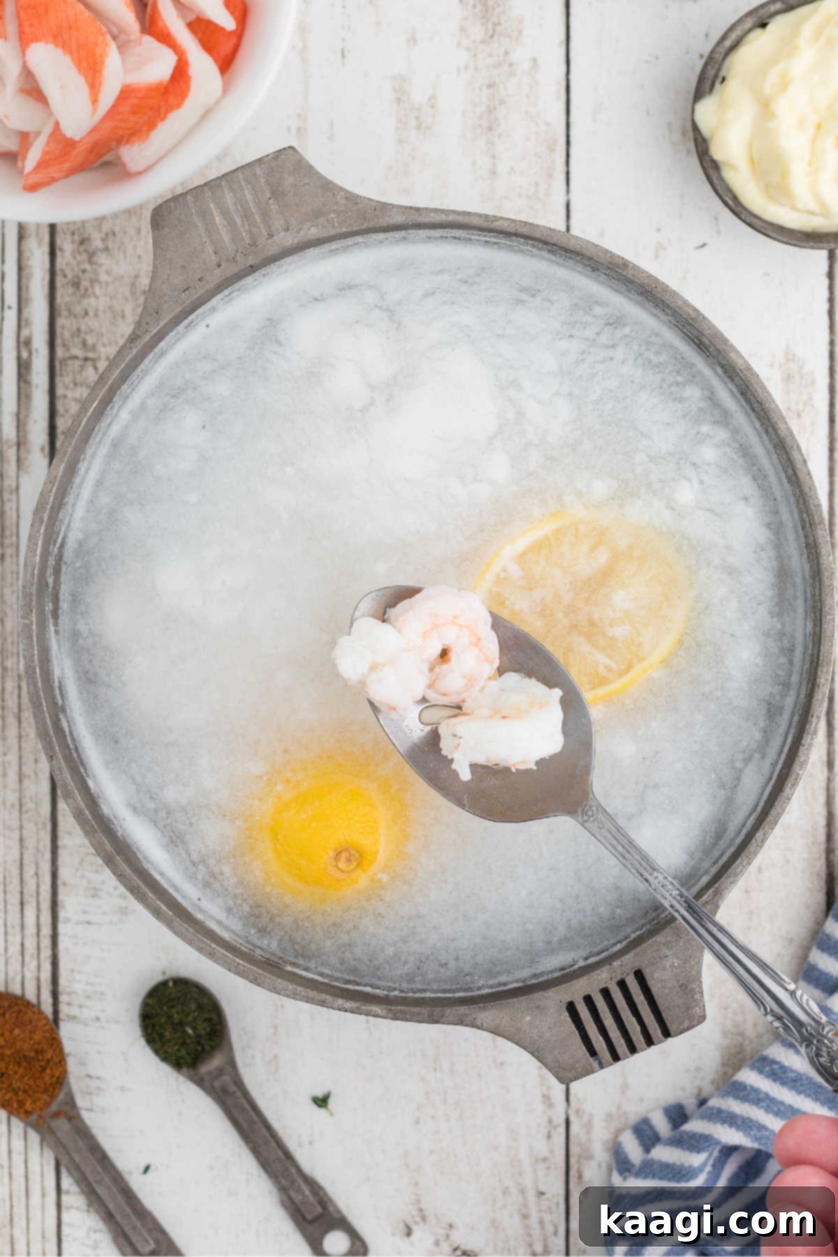 Deep South Seafood Symphony 4 A small pot with lemons and dropping shrimp into the boiling water.