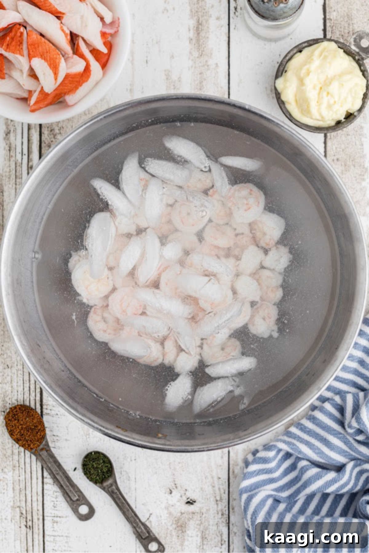 Deep South Seafood Symphony 5 Cooked shrimp in a bath of iced water.