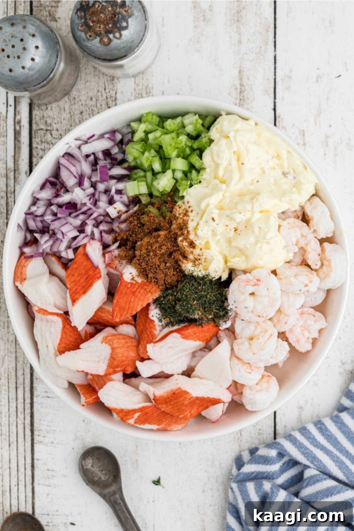 Deep South Seafood Symphony 6 A large salad bowl filled with seafood salad ingredients.