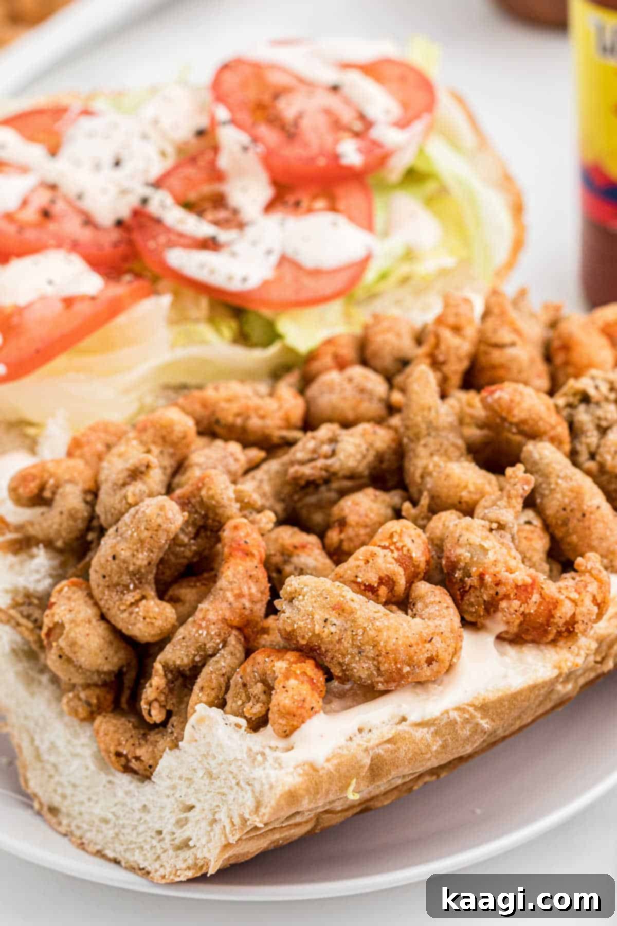 Side view of a fried crawfish poboy.