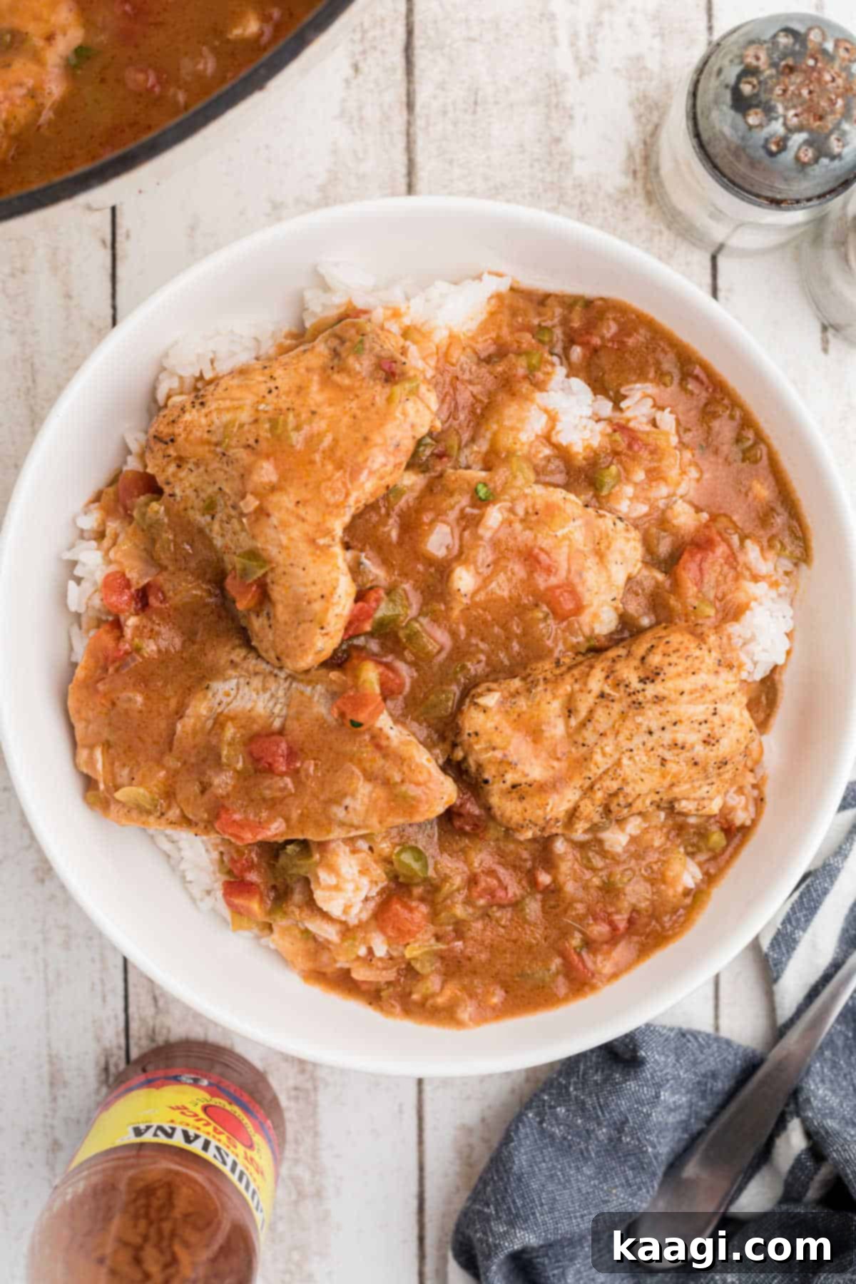 Cajun Catfish Delight 6 Overhead shot of a bowl of catfish courtbouillon over rice.