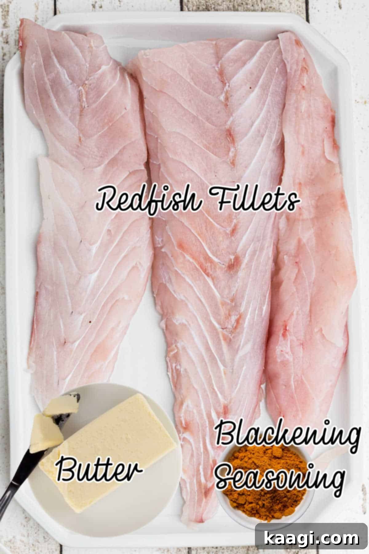 Smoky Cajun Redfish 3 A selection of fresh ingredients laid out on a table, including redfish fillets, a bowl of melted butter, and a container of blackening seasoning, ready for preparation.