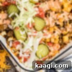 Ultimate Big Mac Comfort Casserole 16 Overhead shot of a corner of a casserole dish with big mac casserole inside.