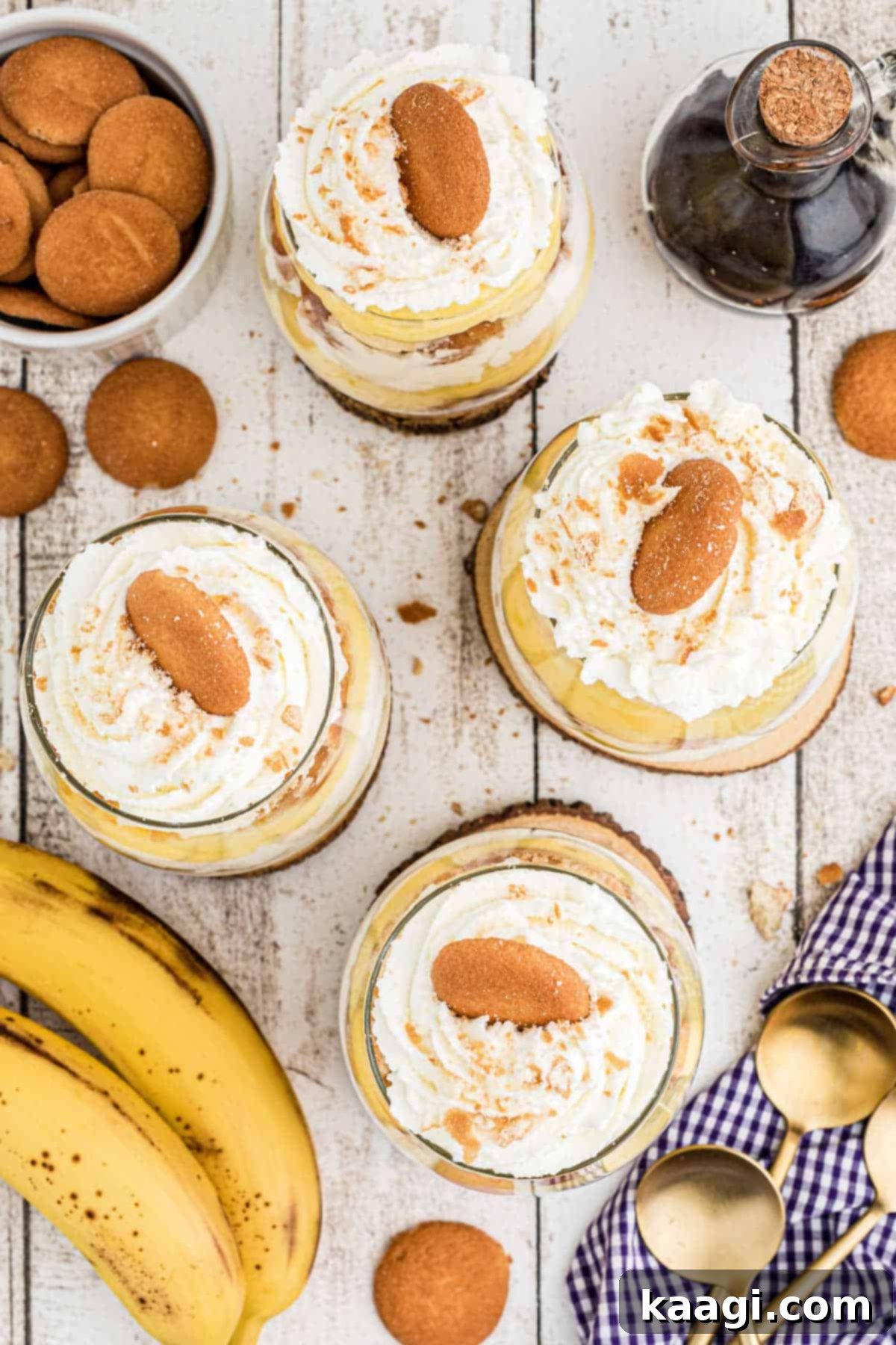 An overhead shot of several banana pudding cups, artfully arranged, highlighting their layered beauty and inviting appearance.