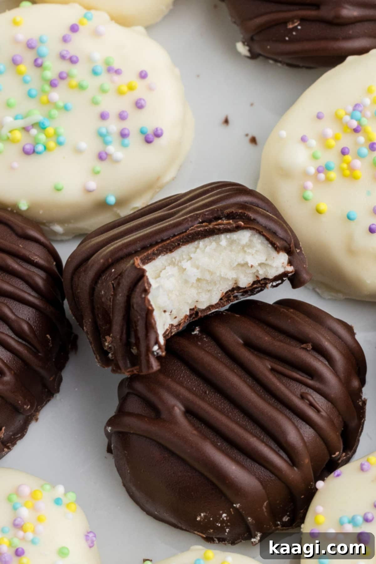 Close up of the inside of a buttercream easter egg, showing its creamy texture and chocolate coating.
