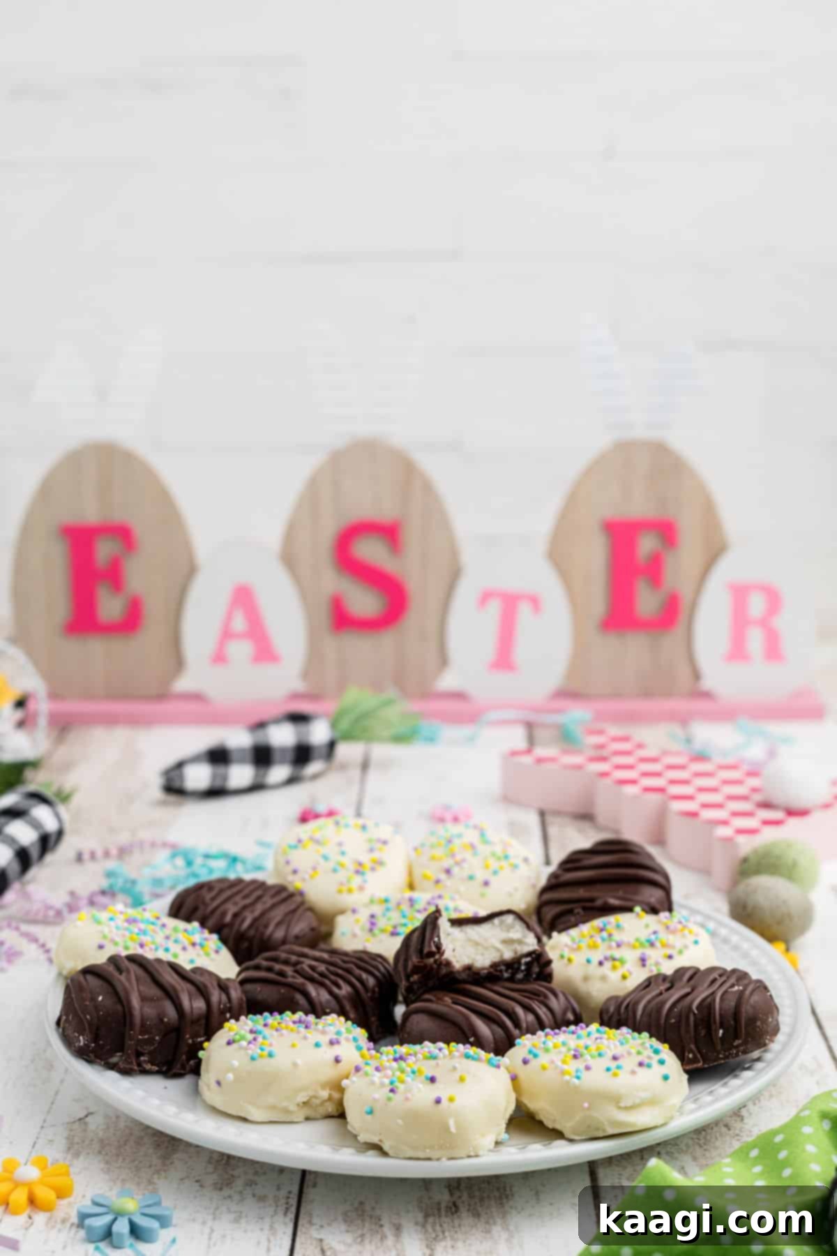 Front view of a dish full of beautifully coated and decorated buttercream easter eggs.