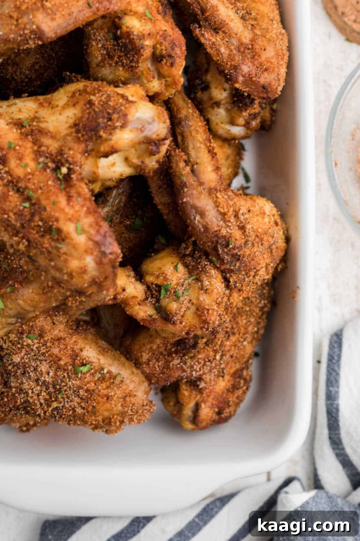 Homemade Wingstop Louisiana Rub 11 Close up overhead shot of golden-brown chicken wings liberally coated with copycat Wingstop Louisiana Rub Recipe.