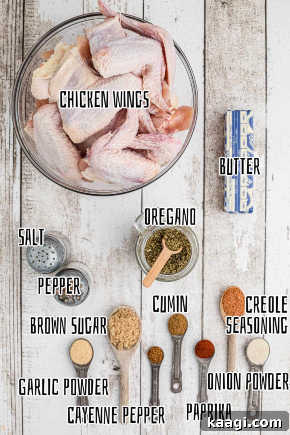 Homemade Wingstop Louisiana Rub 3 Assorted spices and fresh chicken wings laid out, ready to prepare the Wingstop Louisiana Rub.