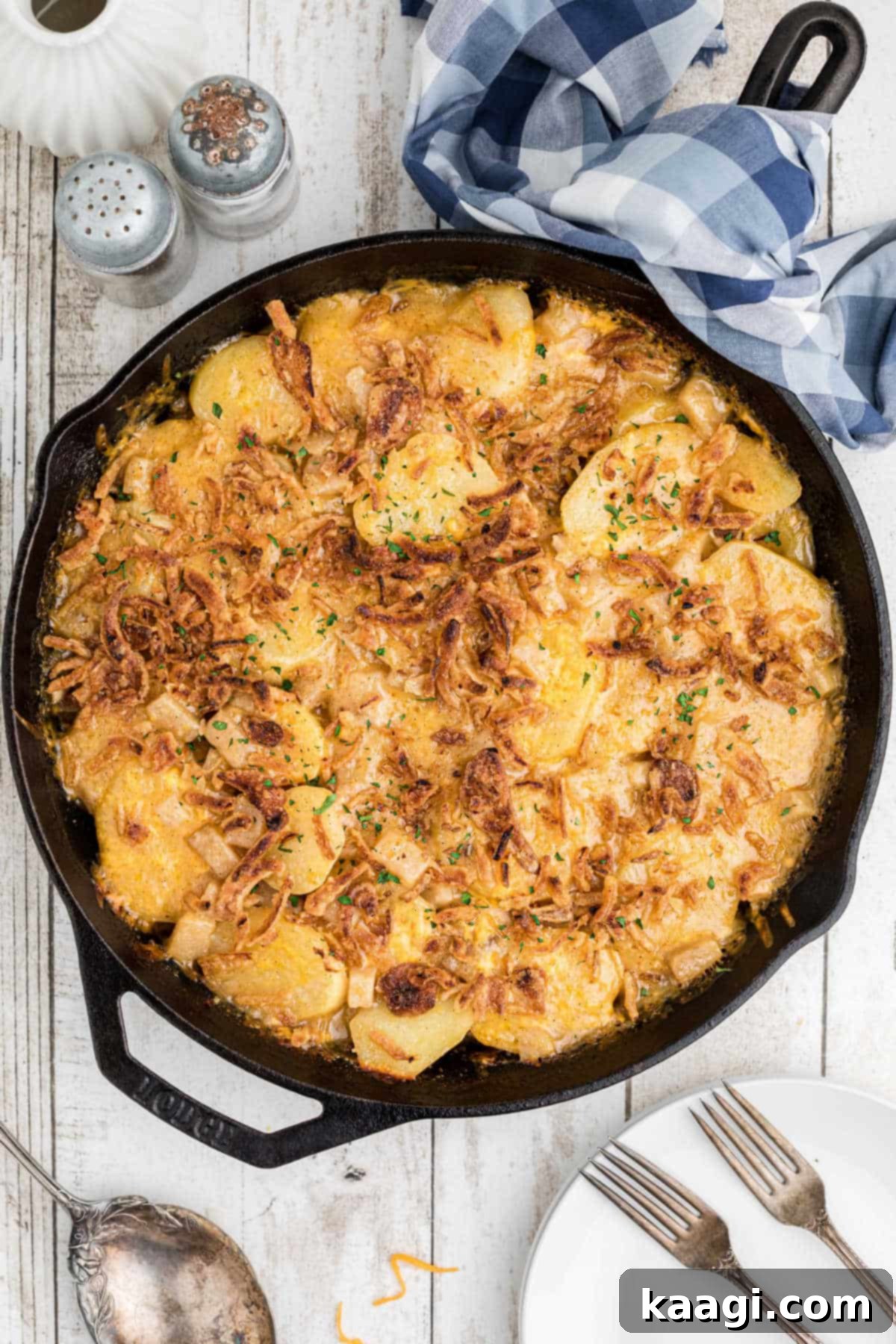 A finished Hobo Casserole in a cast iron skillet, golden brown and bubbling.