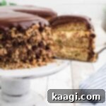 A piece of cake being removed from a banana dream cake.