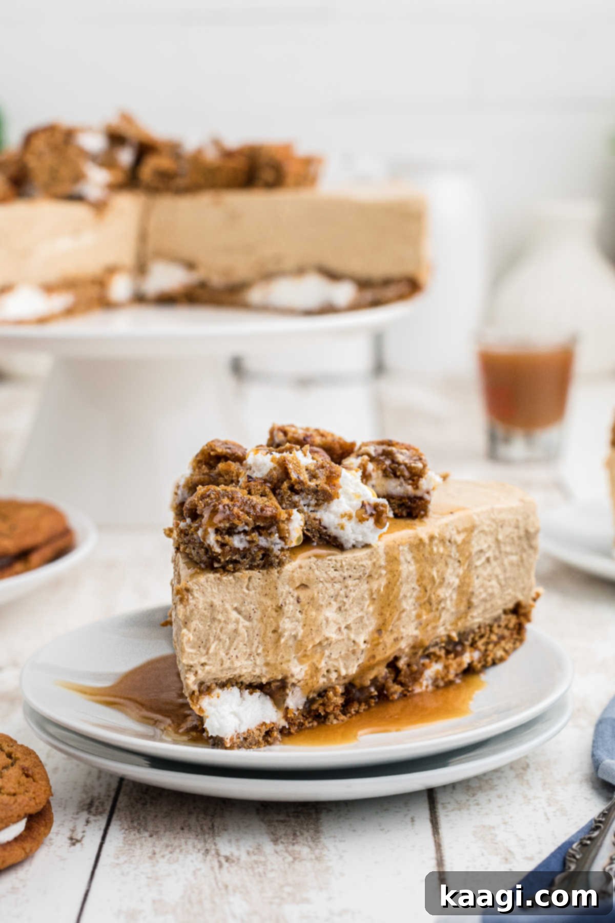 A piece of oatmeal creme pie cheesecake drizzled with luscious caramel sauce, ready to be served.