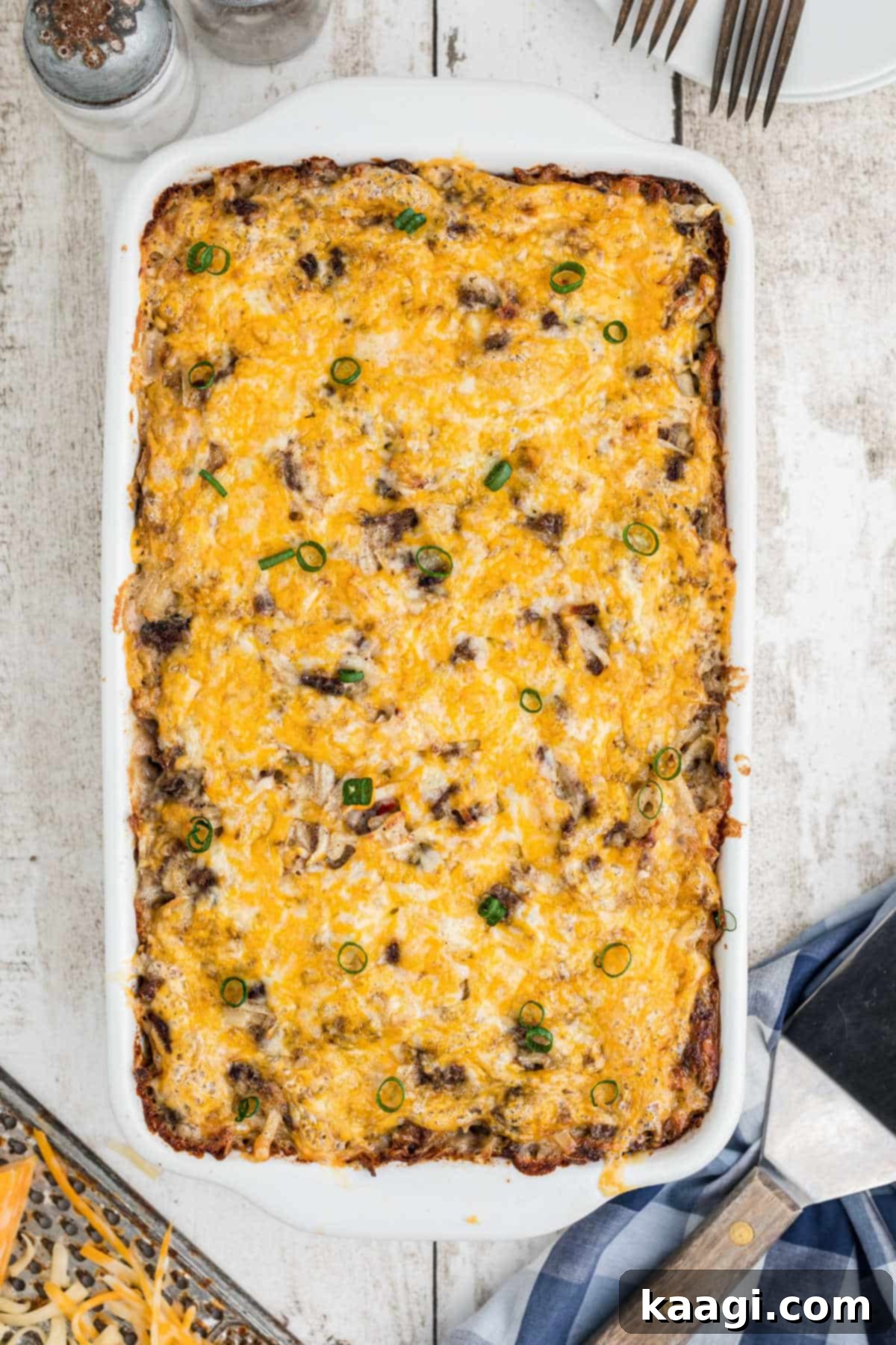 An overhead view of the finished Hamburger Hashbrown Casserole, perfectly golden and bubbly.