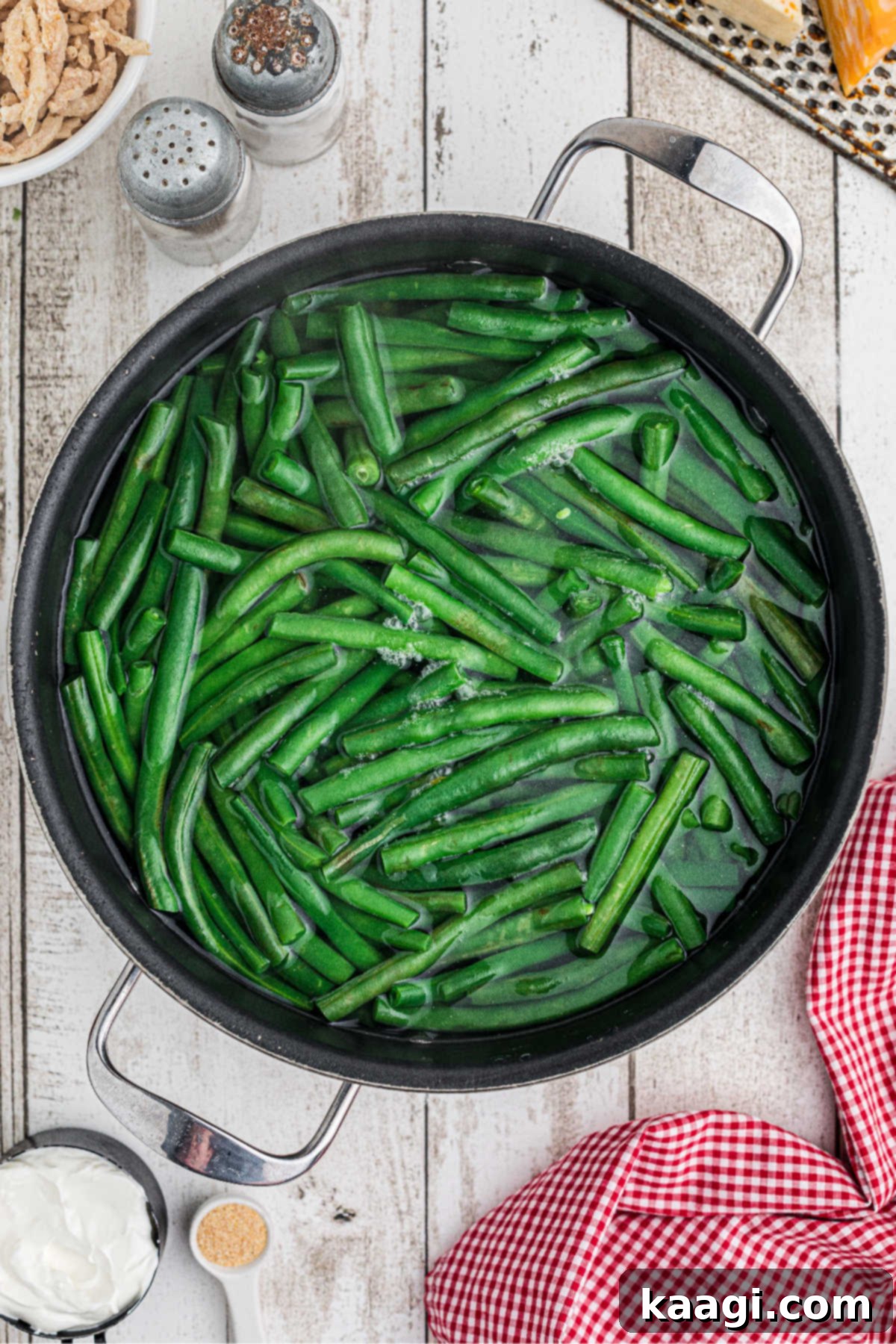 Green beans in a pot of water.