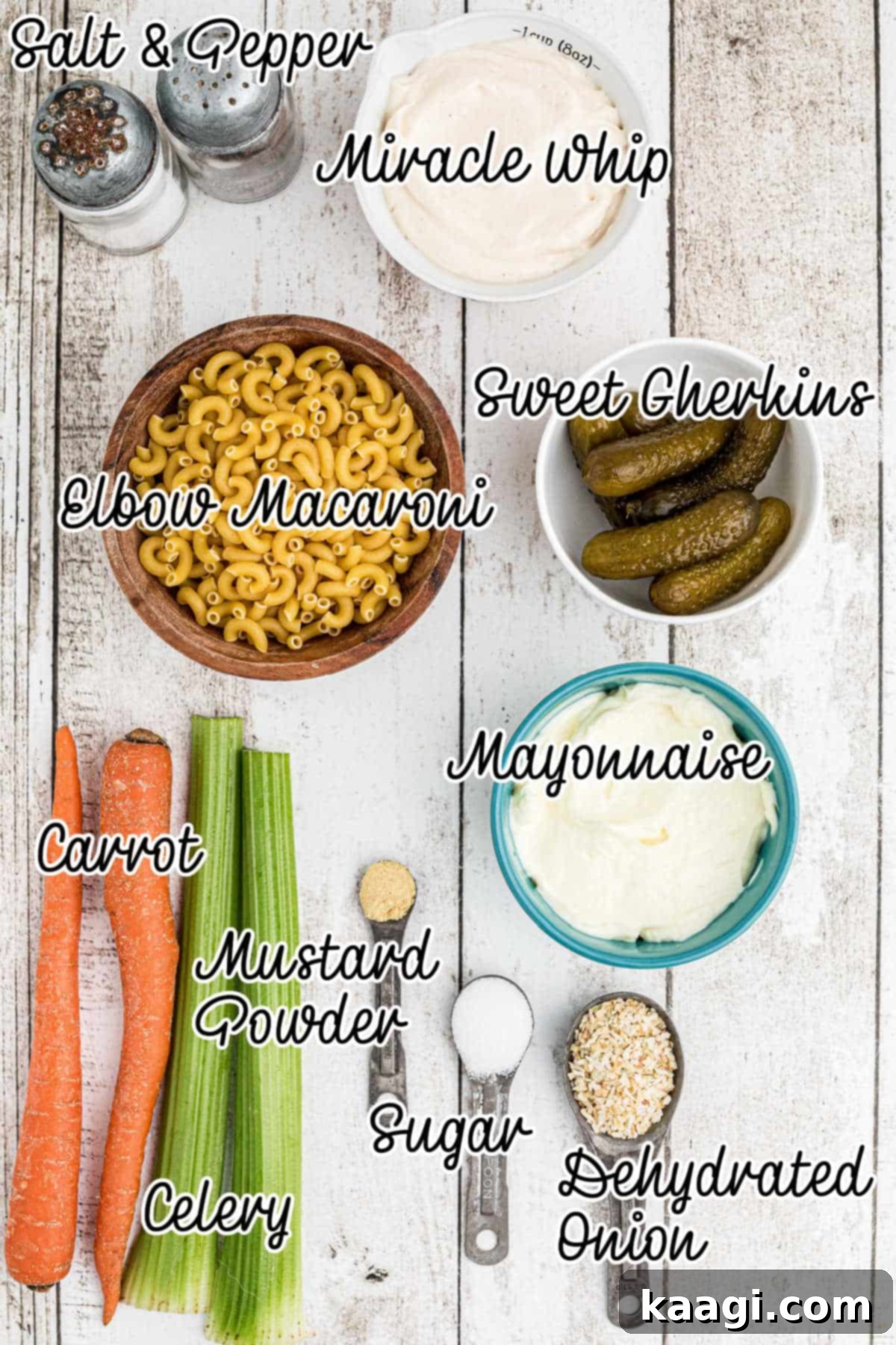 Various fresh and pantry ingredients laid out for a KFC Macaroni Salad recipe.