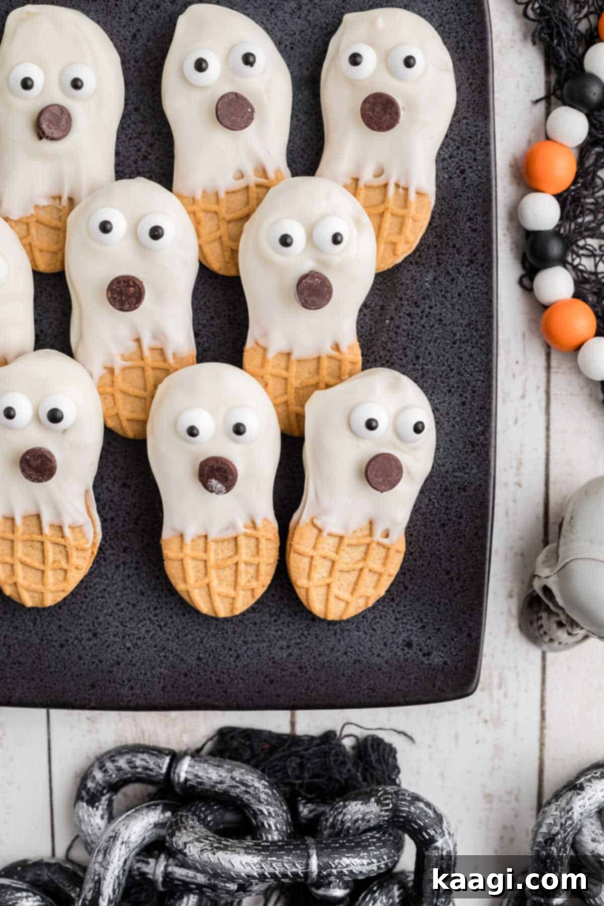 Boo-tter Bites 5 Close up side shot of a corner of a plate with Nutter Butter Ghosts, as a Halloween Treat.