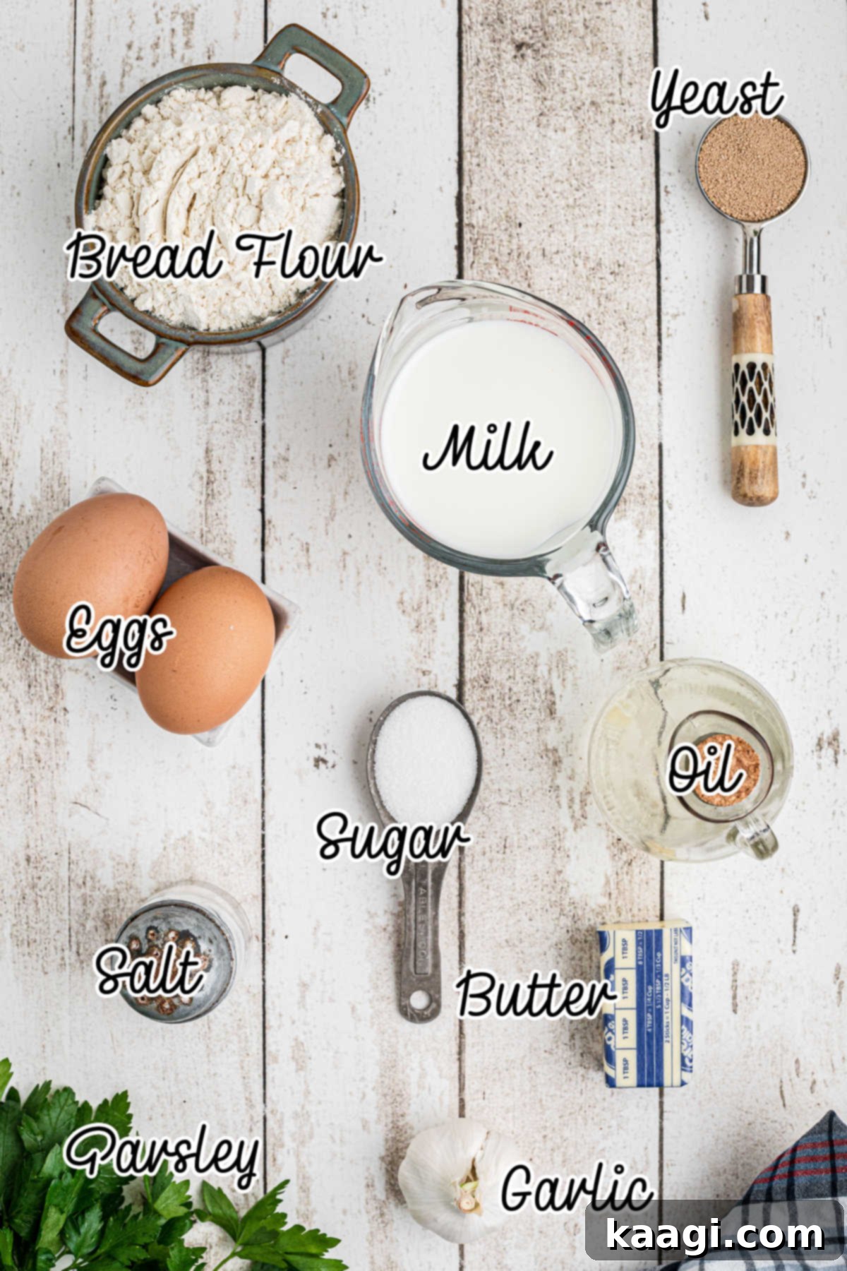 Melt-in-Your-Mouth Garlic Butter Buns 3 A collection of fresh ingredients laid out on a surface for making garlic butter rolls.