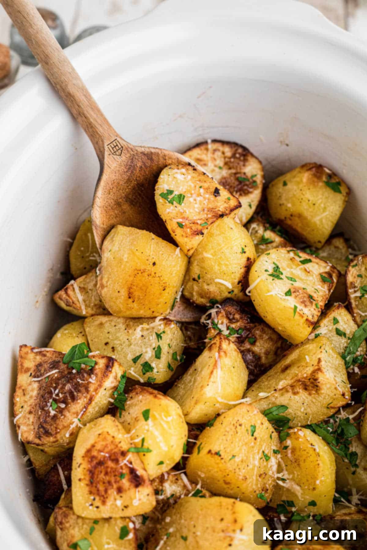 Perfectly Tender Slow Cooker Roast Potatoes 2 Overhead shot of a slow cooker roast potatoes recipe, beautifully garnished and ready to serve.