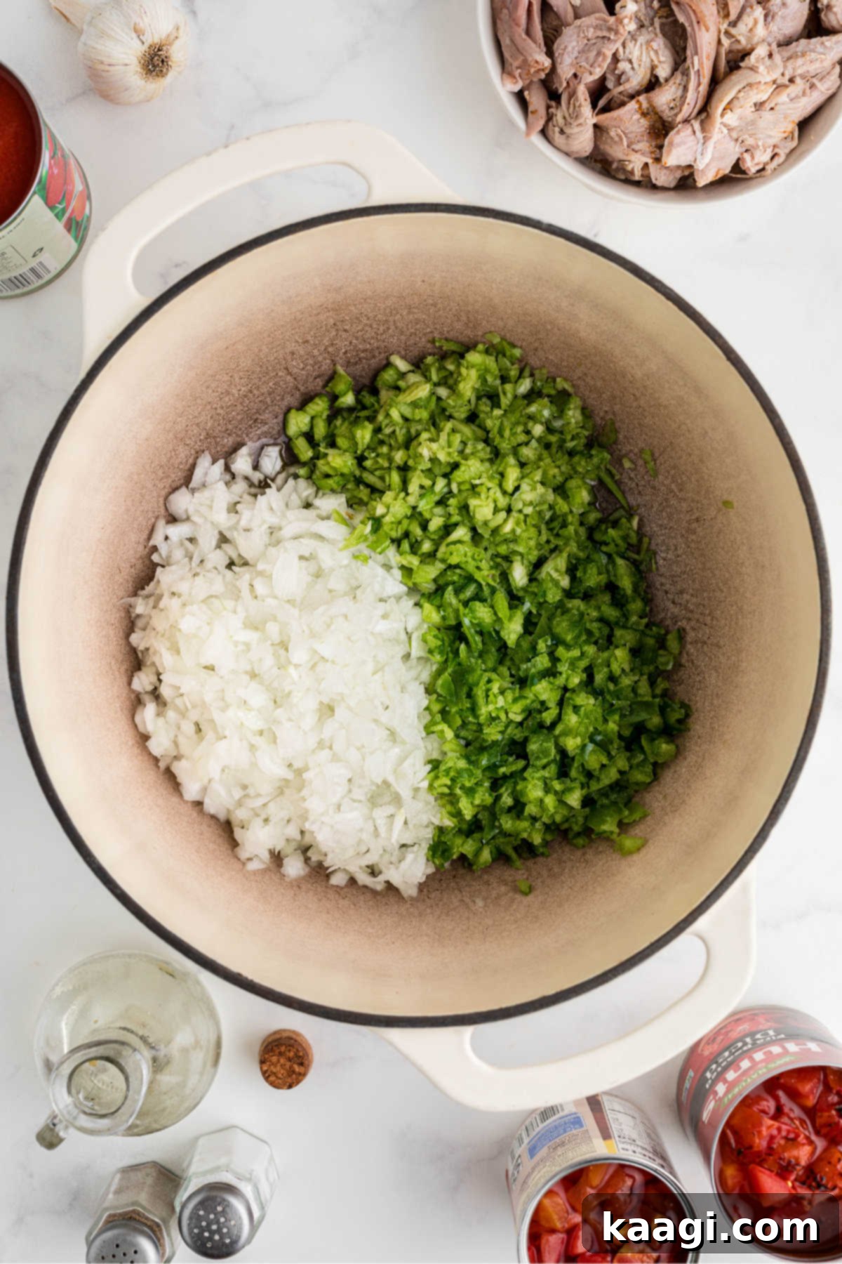Rich and Hearty Dutch Oven Turkey Chili 4 A Dutch oven with onions, bell peppers and celery about to be cooked.