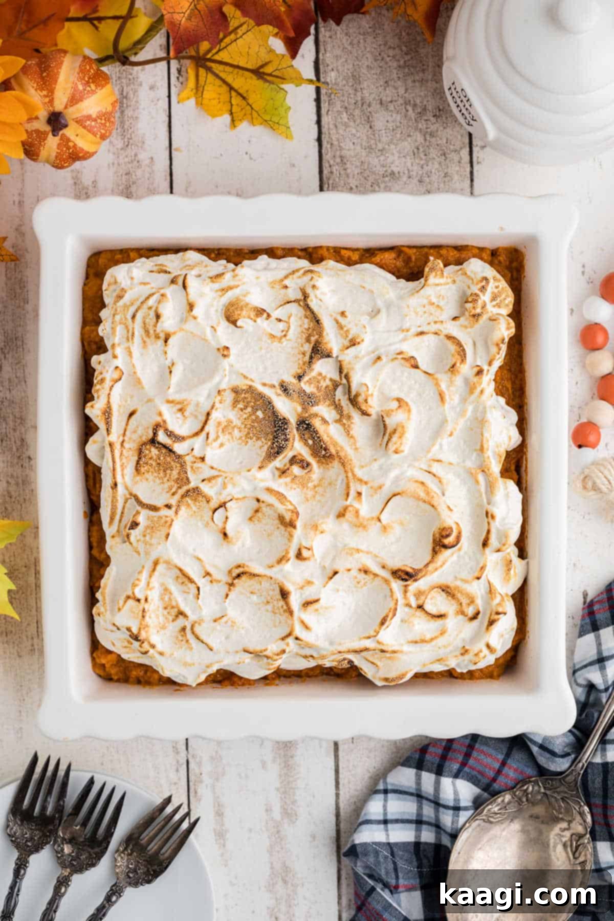 An inviting overhead shot of a full dish of sweet potato fluff, showing the generous and perfectly toasted marshmallow topping.