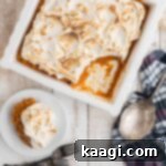 Overhead shot of a sweet potato fluff in a dish, with a spoon missing.