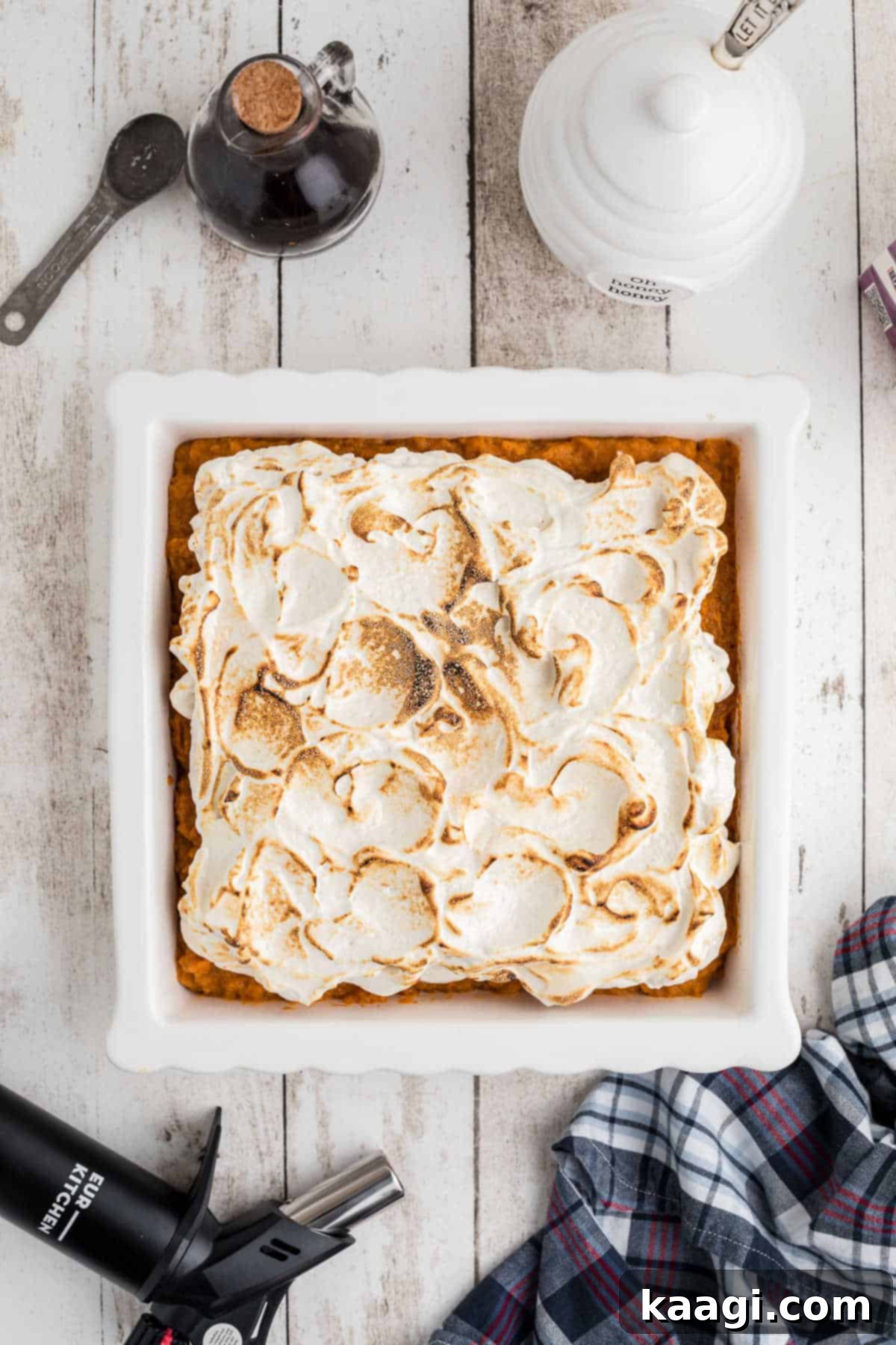 A close-up shot of the sweet potato fluff after its marshmallow topping has been perfectly torched to a golden brown.