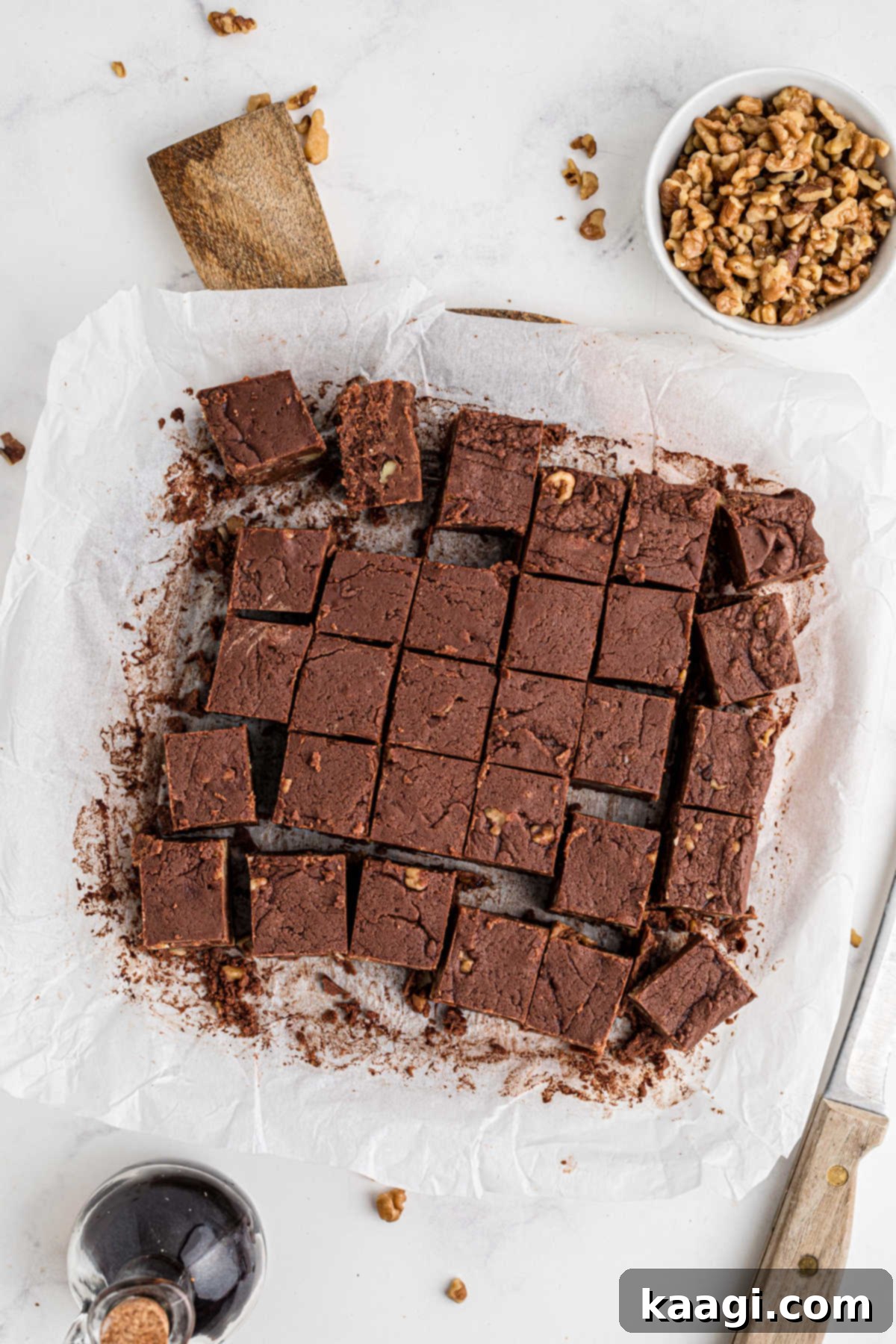 An inviting overhead view of freshly cut Amish Fudge cubes arranged neatly on a wooden cutting board.