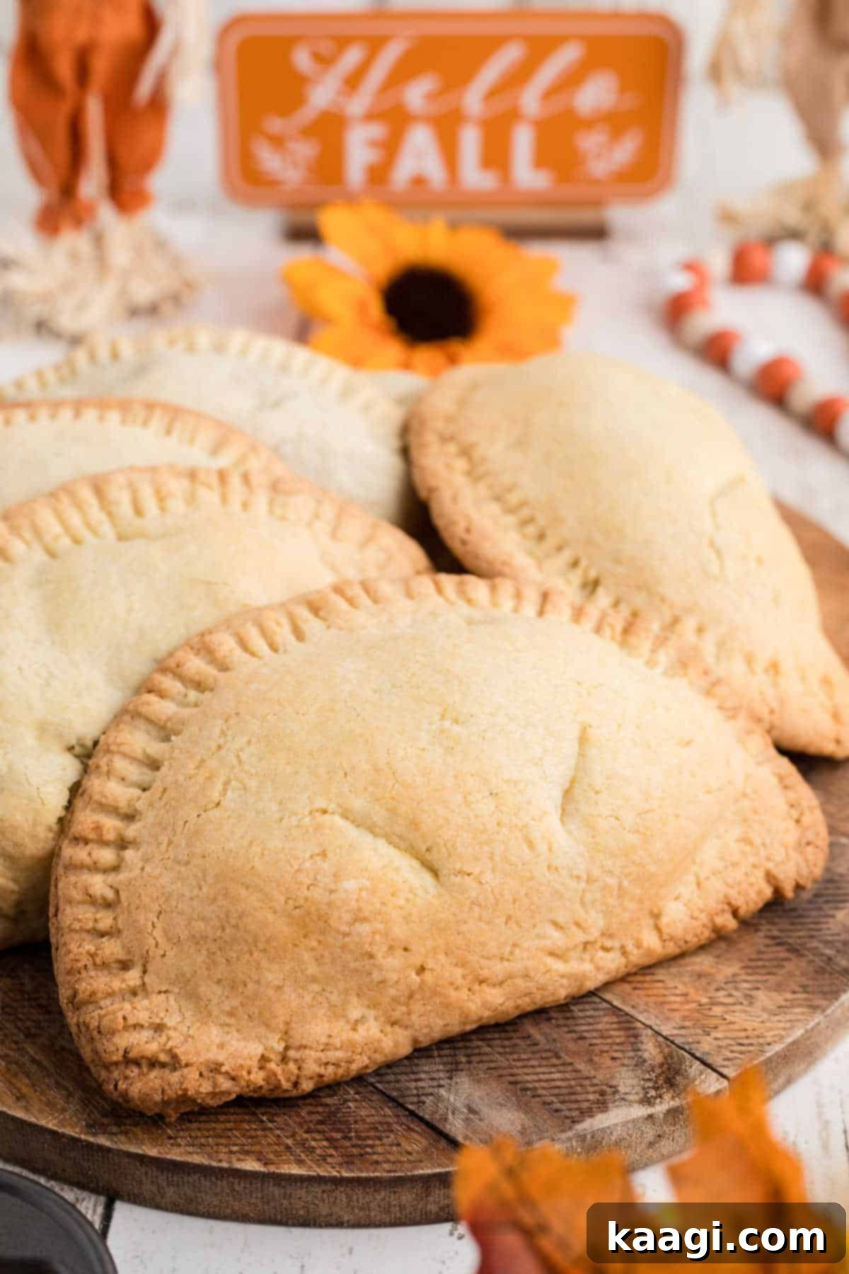 Sweet Potato Hand Pies on a board with fall decor.