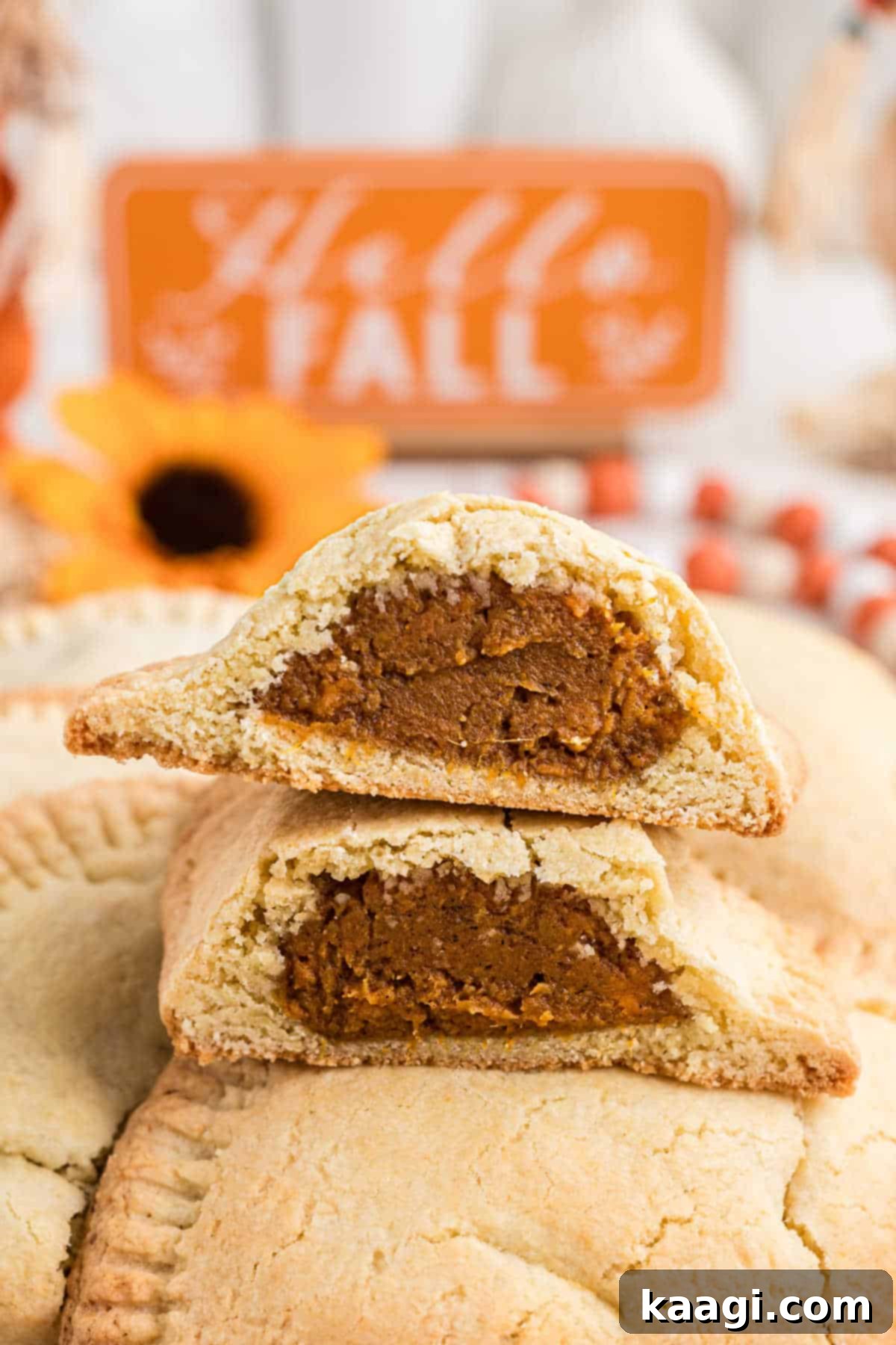 Sweet Potato Hand Pies cut in half with fall decor.