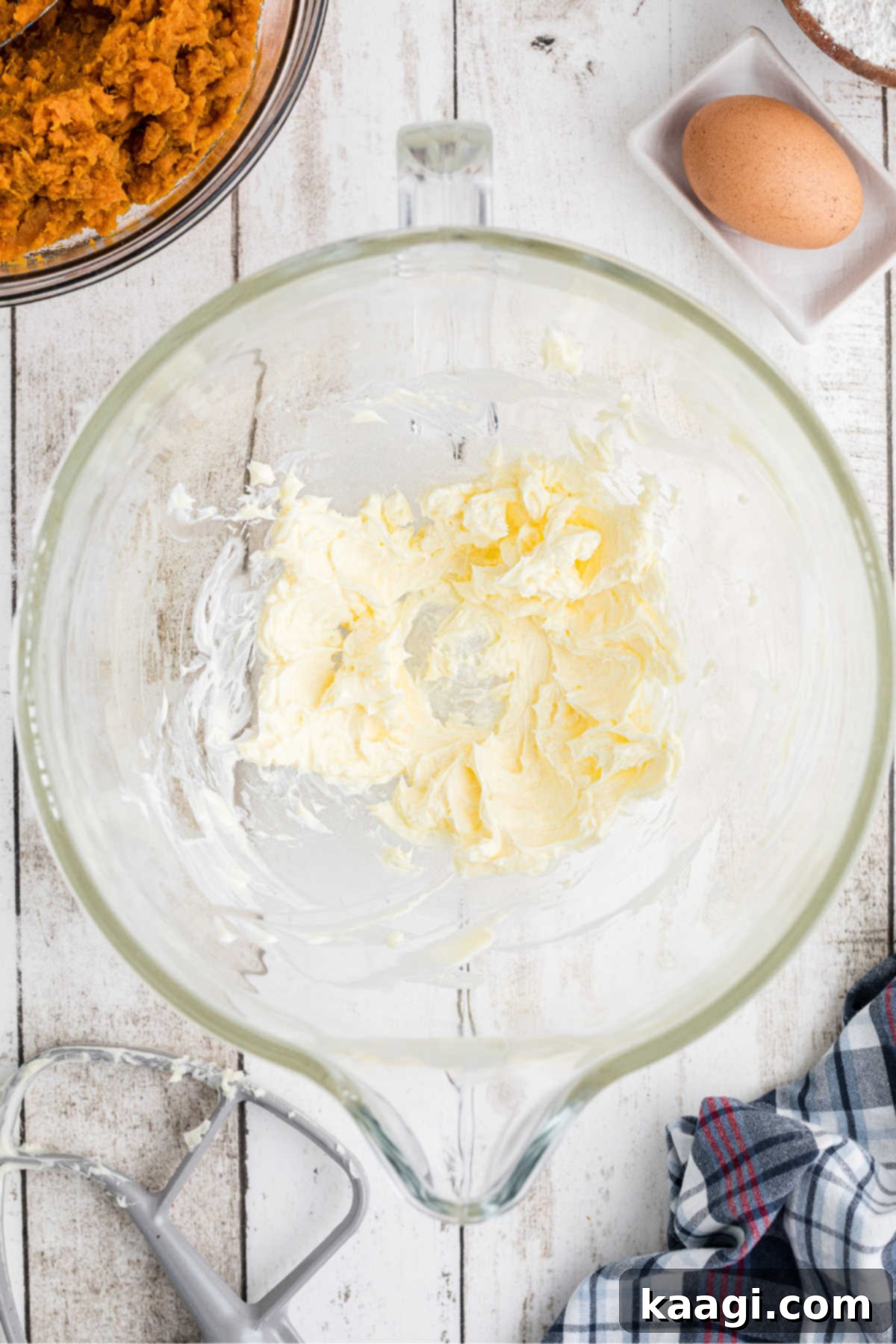 Mixing bowl filling with butter.