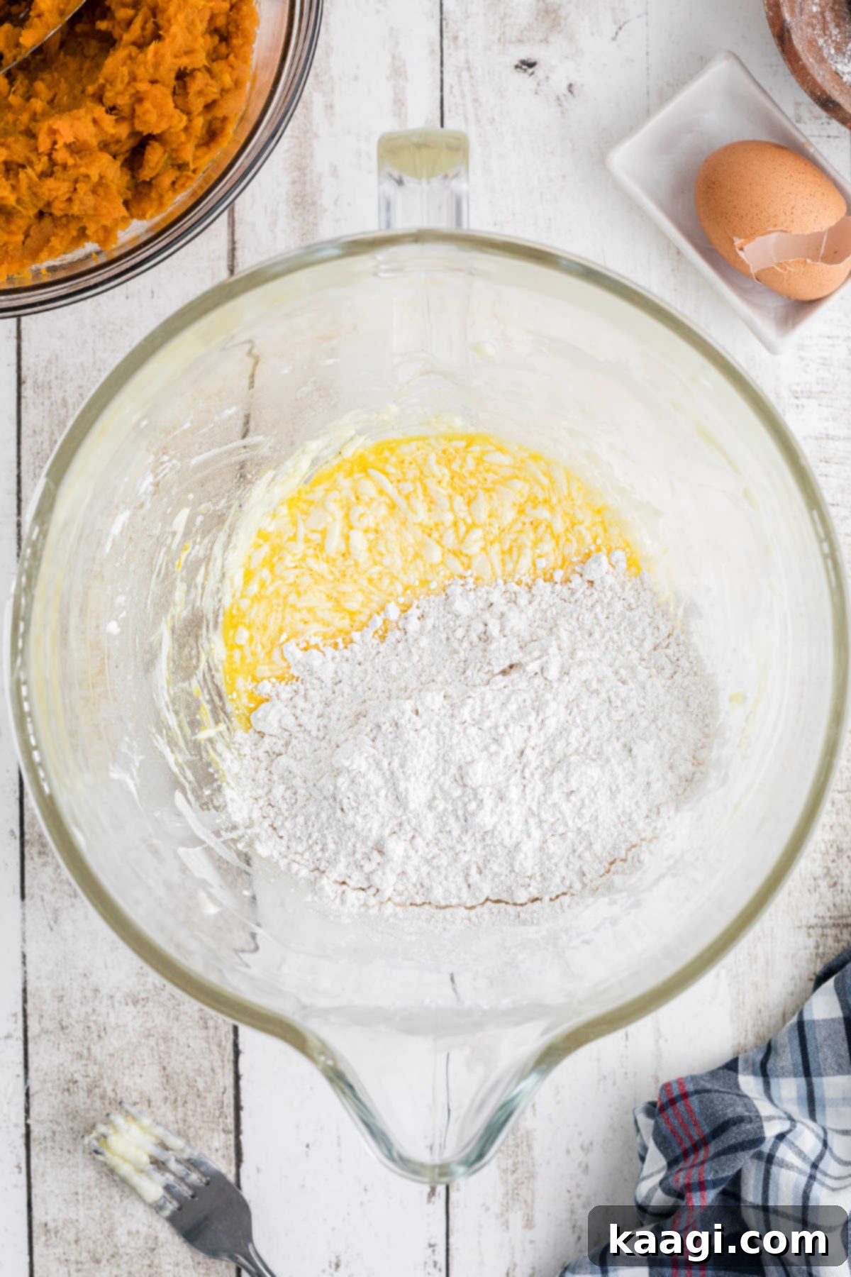 Flour mixture added to a mixing bowl.