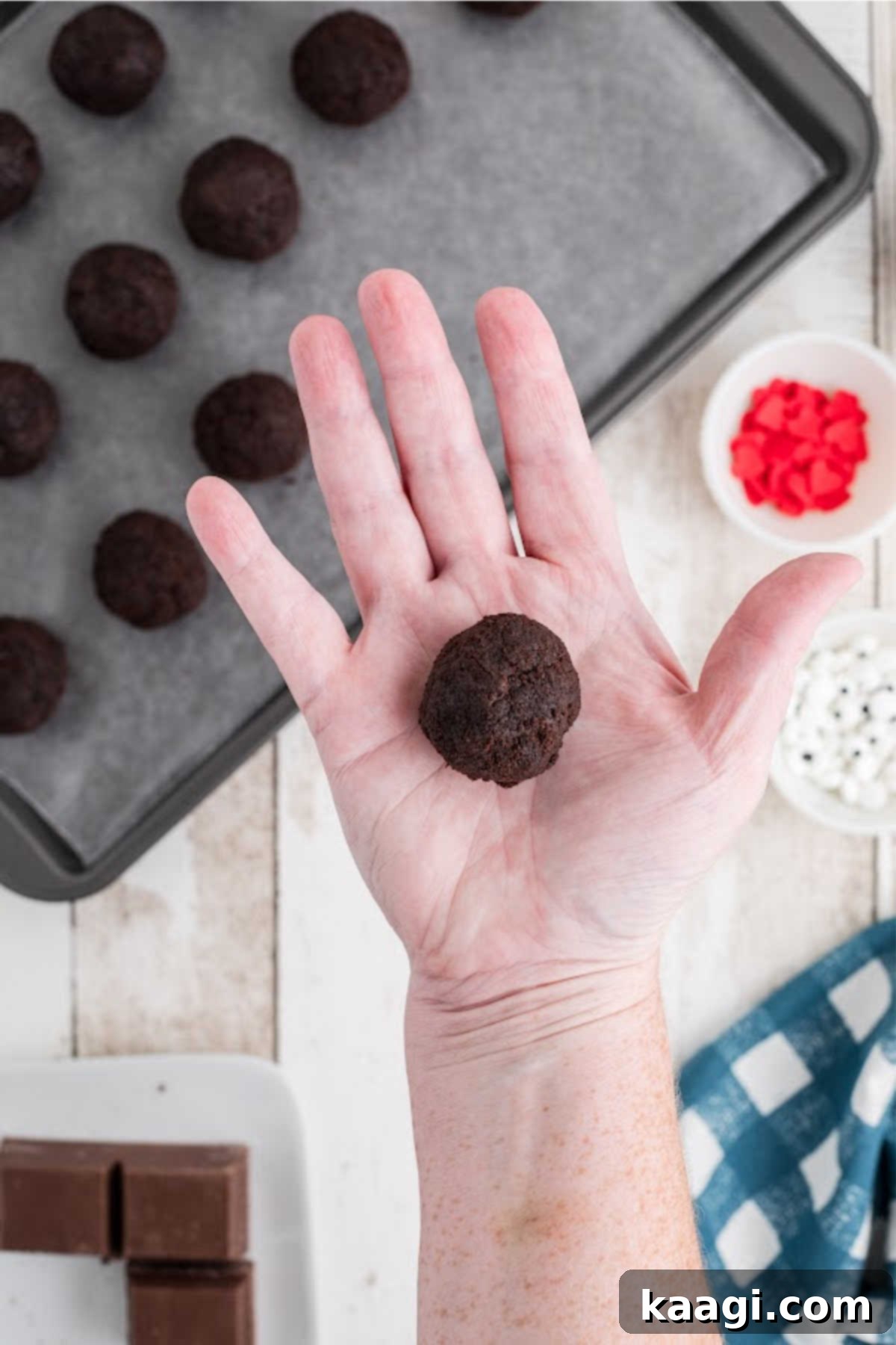 Festive Thanksgiving Cake Pops 6 A hand expertly rolling a portion of cake mixture into a perfectly spherical cake pop ball.