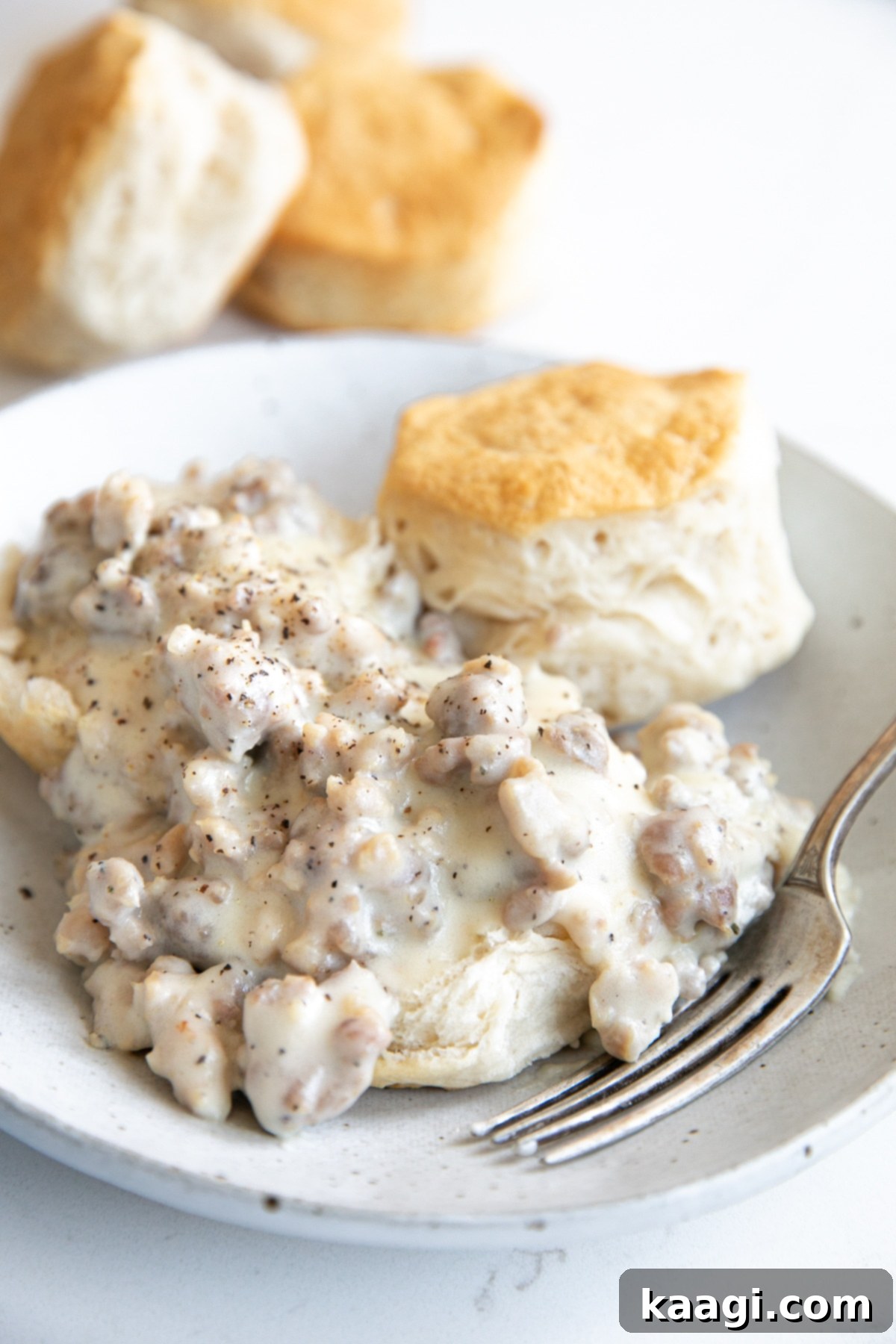 Southern Skillet Classics 9 Fluffy homemade biscuits smothered in a rich, savory sausage gravy, a quintessential Southern breakfast or brunch.