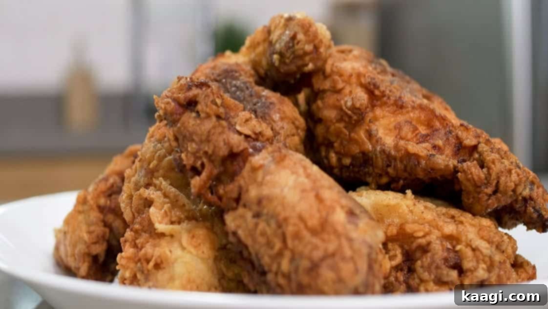 Southern Skillet Classics 23 A close-up shot of perfectly golden-brown, crispy fried chicken, a benchmark of Southern cuisine.
