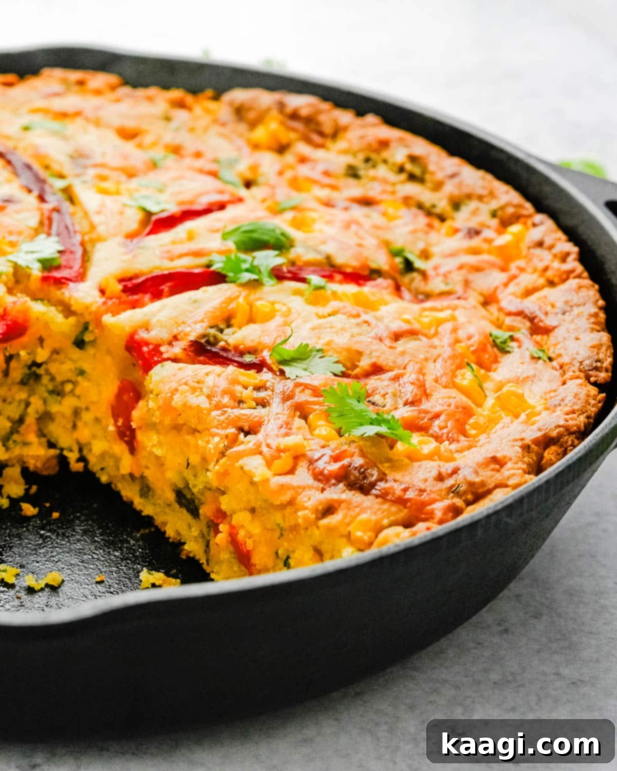 Southern Skillet Classics 39 Cheesy skillet cornbread loaded with fresh corn, roasted red bell peppers, cheddar, and famous New Mexico green chiles.