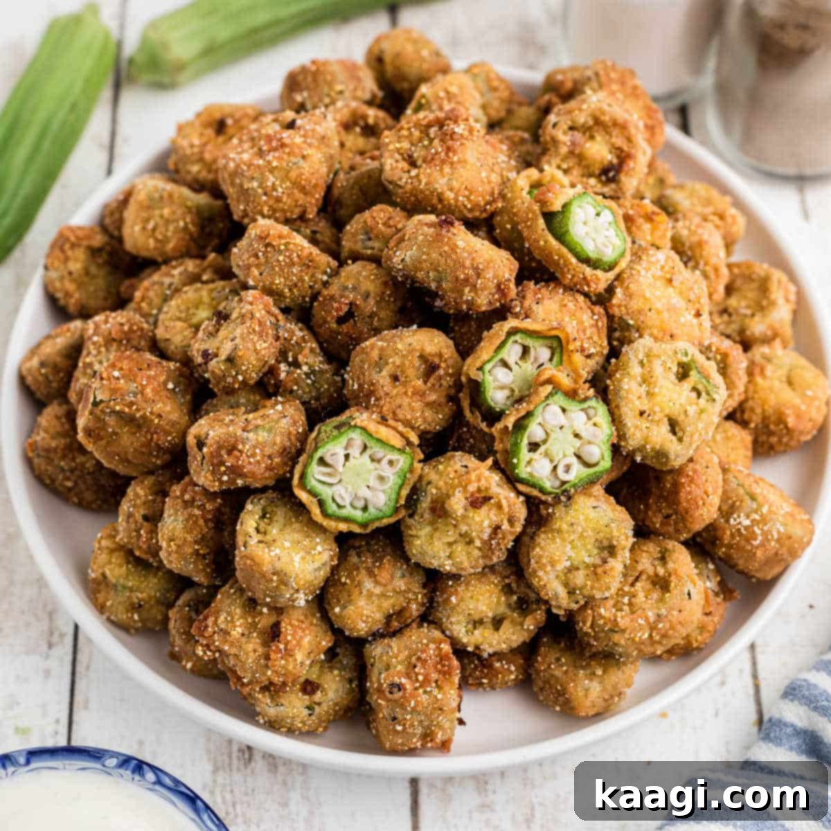 Southern Skillet Classics 27 An image of a plate full of old fashioned pan fried okra with one or two cut in half to see the inside.