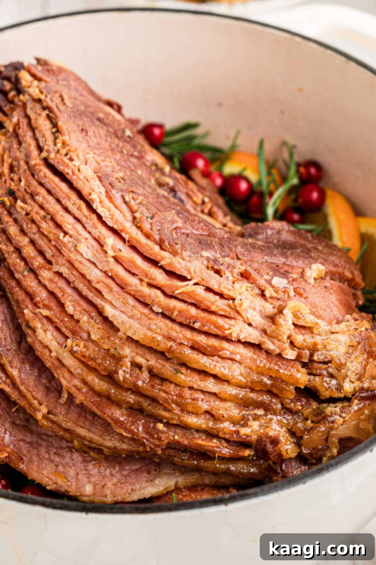 Close up shot of a Dutch Oven Ham, beautifully sliced and ready to serve.
