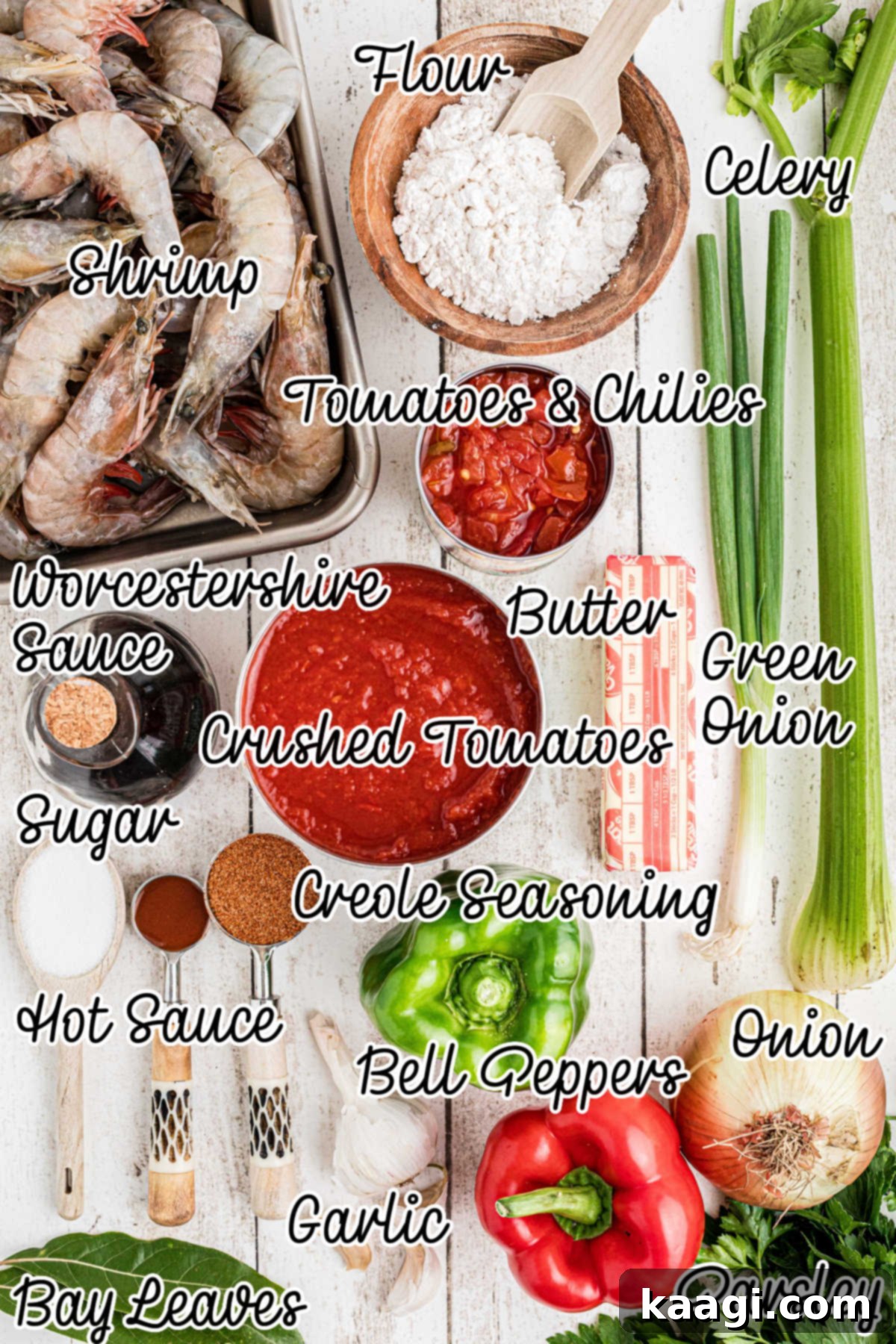 Various fresh ingredients laid out on a wooden surface, including shrimp, vegetables, and canned goods, ready for making New Orleans Shrimp Creole.