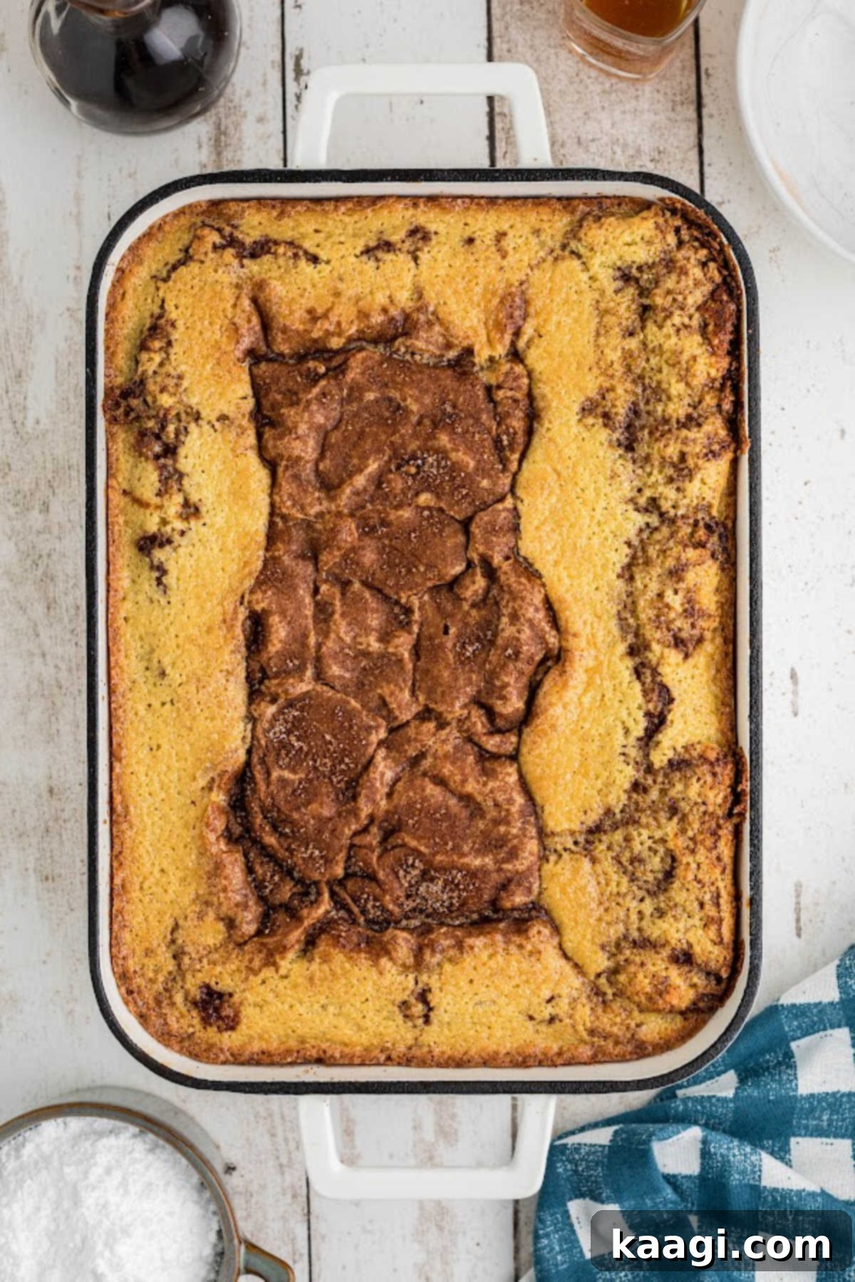 A freshly baked honey bun cake, golden brown and perfectly risen, just removed from the oven.