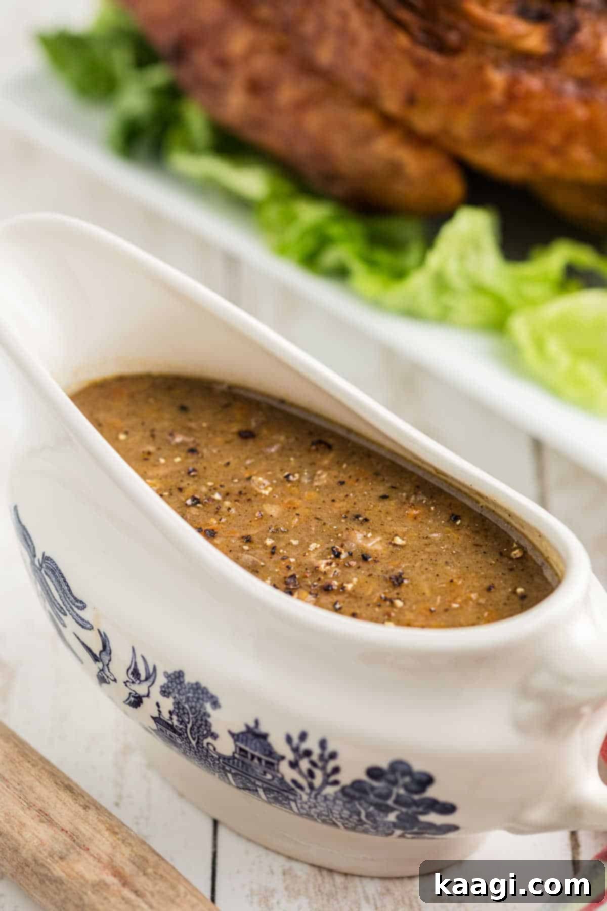 Southern giblet gravy in a gravy boat, a classic Thanksgiving staple.